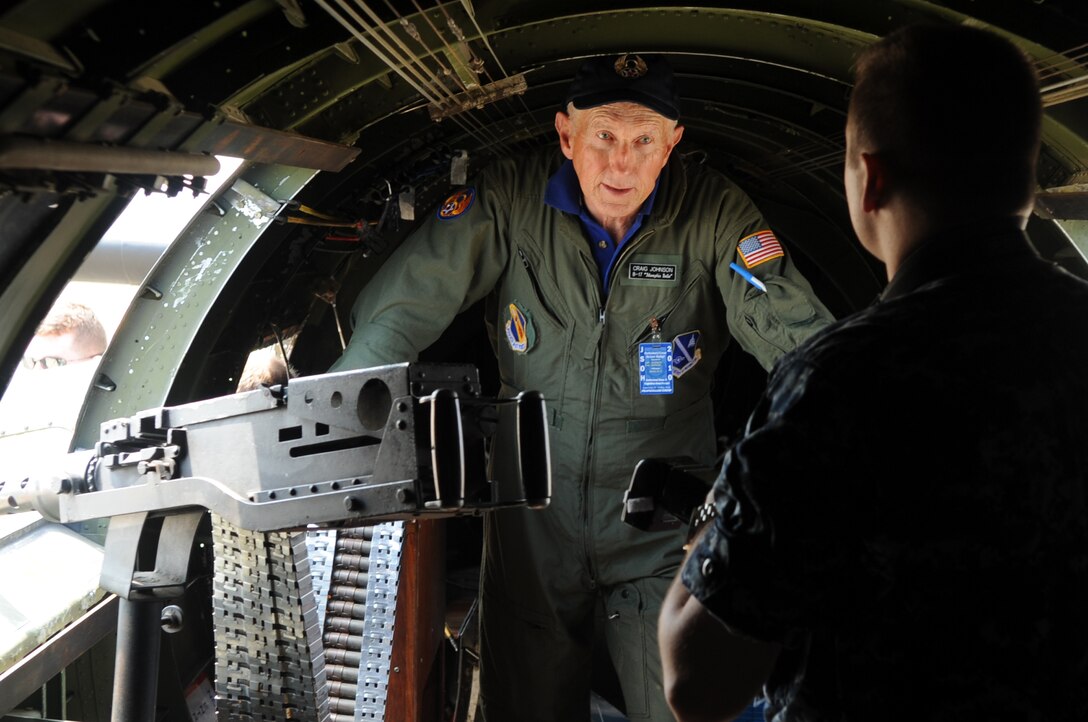 JOINT BASE ANDREWS, Md. --  Mr. Craig Johnson, B-17 pilot, talks to a sailor inside a B-17  used in the movie “Memphis Bell” during the 2010 Joint Service Open House here May 14. Fourteen B-17’s are currently in active circulation out of the original 5,000 built during World War II. (U.S. Air Force photo by Senior Airman Melissa V. Brownstein)