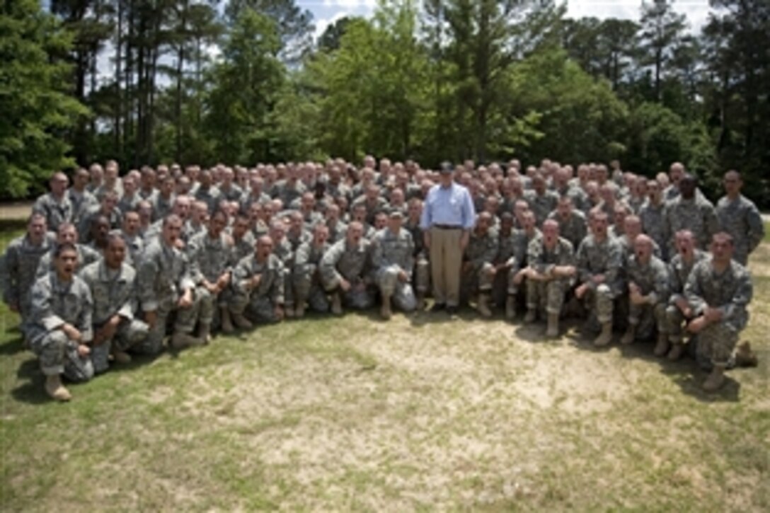 Defense Secretary Robert M. Gates poses with Army Basic Trainees as they yell "HOOAH" on Fort Benning, Ga., May 15, 2010. 