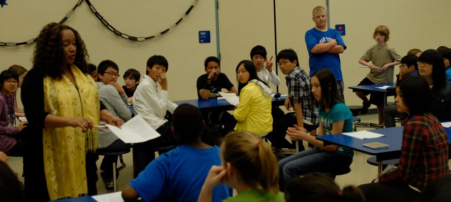 Osan Middle School Principal Dr. Jennifer Smith, left, answers a question from a student during the opening ceremonies of the 2010 Osan English Camp May 18, 2010, at Osan Air Base, Republic of Korea. Eighth grade students from Osan Middle School and 23 students from 22 schools in the Pyeongtaek area are taking part in the program this year, which matches Korean students with host U.S. families for three days of educational and cultural immersion. This is the first year eighth-grade students have been included in the program; since its inception in 2005, the camp was geared toward twelfth-grade students. (U.S. Air Force photo/1st Lt. Chris Hoyler) 