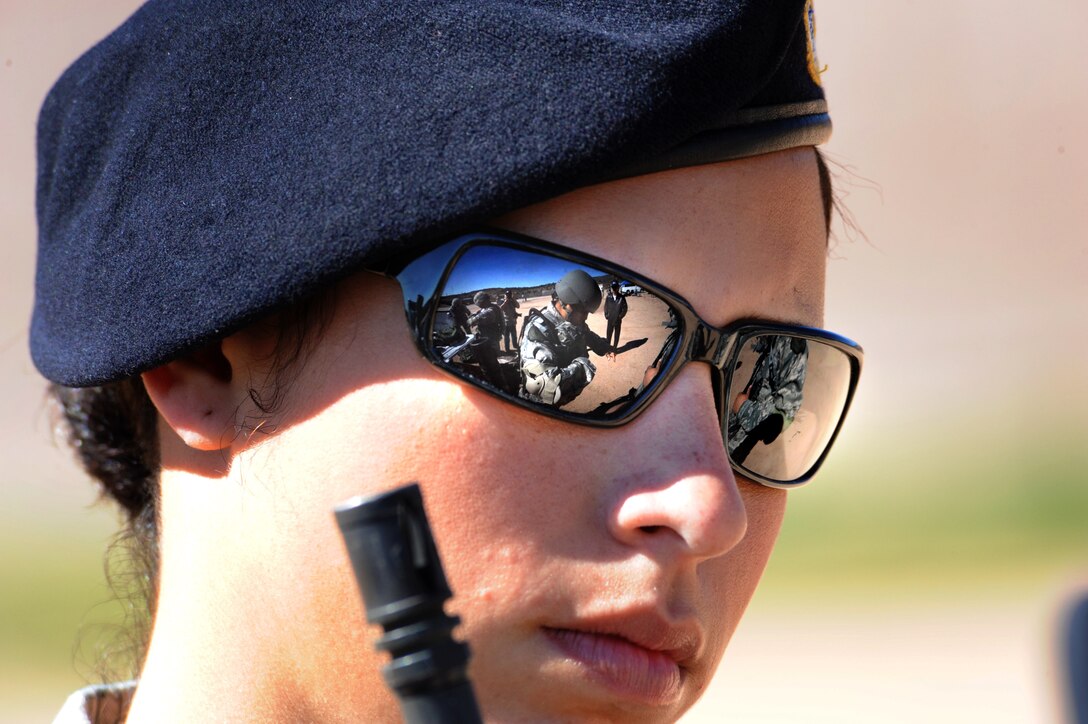 The Space and Missile Systems Center's 61st Security Forces Squadron Guardian Challenge 2010 team gets ready under the watchful eyes of 2nd Lt. Alea Nadeem, team coach, prior to the marksmanship competition May 17. (Photo by Lou Hernandez)