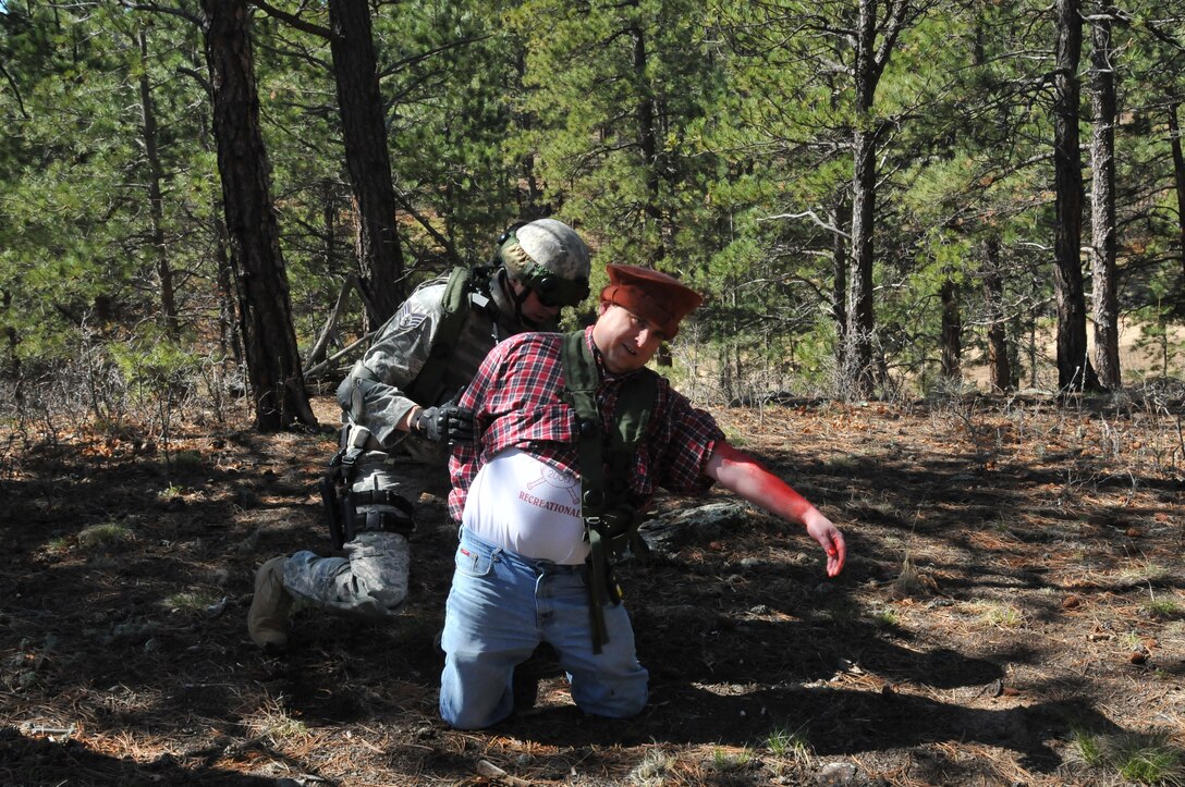 Staff Sgt. Alex Andriyanov from the 61st Security Forces Squadron, Space and Missile Systems Center, checks the injuries on a simulated local national during the tactics competition at Guardian Challenge May 16, 2010. (Photo by Lou Hernandez)