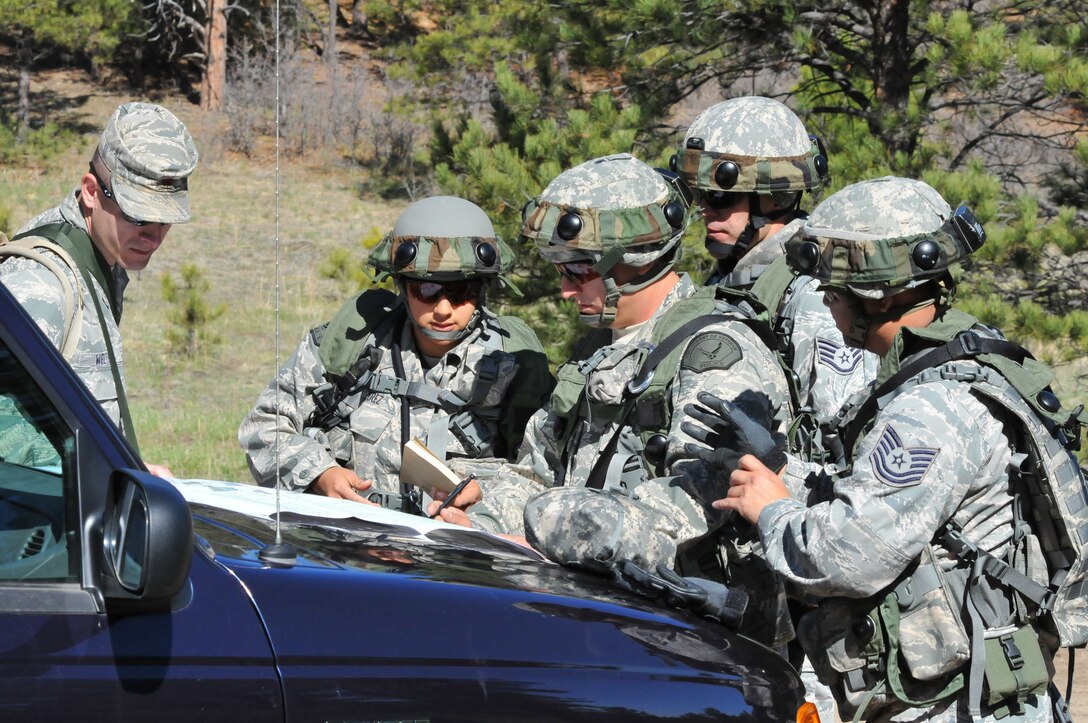 Space and Missile Systems Center's 61st Security Forces Squadron members from Los Angeles Air Force Base receive instruction from the judges before the start of the tactics competition for Guardian Challenge 2010 May 15. (From left to right) DoD Officers Yvette Perez and Steven Haymes, Staff Sgt. Alex Andriyanov and Tech. Sgt. Rochanapan  Silpe (Photo by Lou Hernandez)