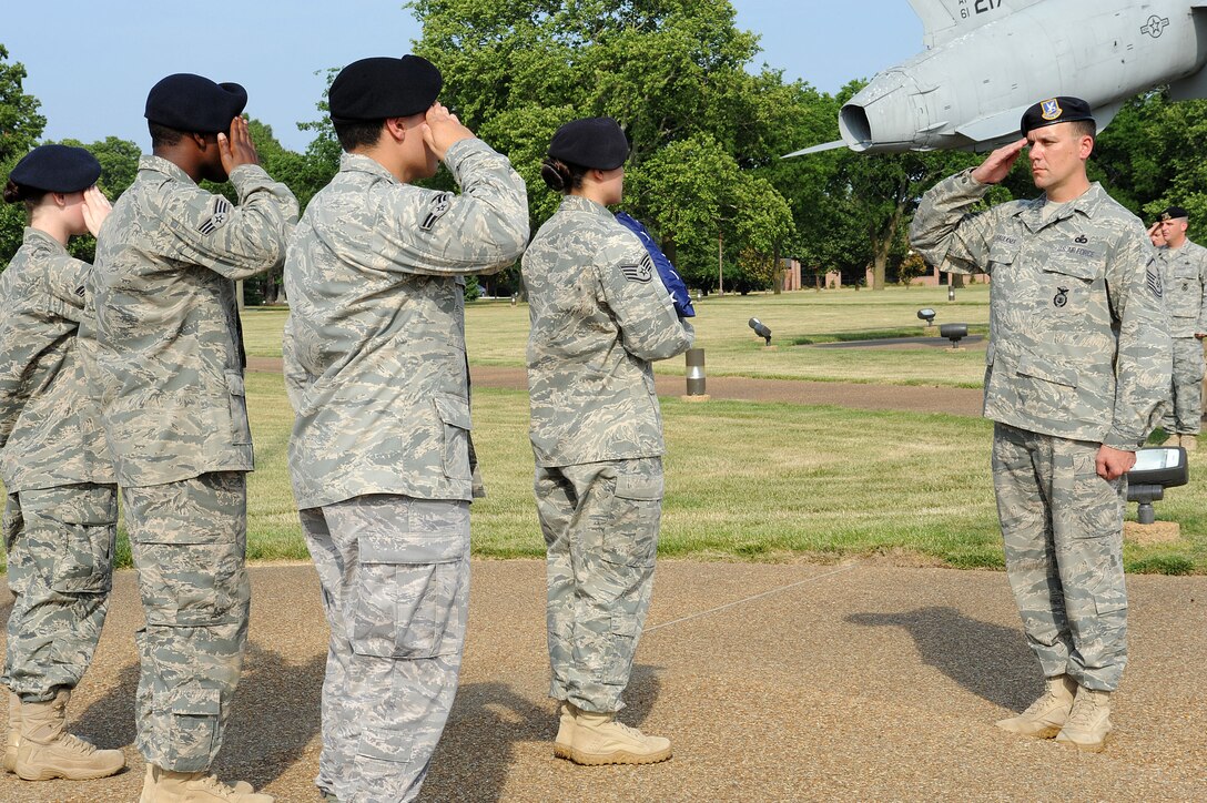 LANGLEY AIR FORCE BASE, Va. -- Master Sgt. Matthew Faulkner, 633d Security Forces Squadron, salutes the flag during a formal retreat ceremony honoring National Police Week May 14. Police Week is held annually to honor police officers, military and civilian, who have lost their lives in the line of duty. (U.S. Air Force Photo/Staff Sgt. Christina M. Styer) 