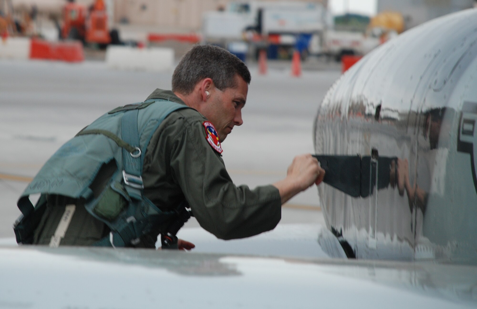 LAUGHLIN AIR FORCE BASE, Texas – Col. Jeffrey McDaniels, 47th Flying Training Wing commander, inspects a T-38 Talon aircraft just before his last flight as wing commander May 17. Upon landing, as is tradition for the outgoing commander, Colonel McDaniels taxied through an arch of water supplied by fire trucks from Laughlin’s fire department and was drenched with a fire hose by his wife after exiting the aircraft. (U.S. Air Force photo by Airman 1st Class Blake Mize)