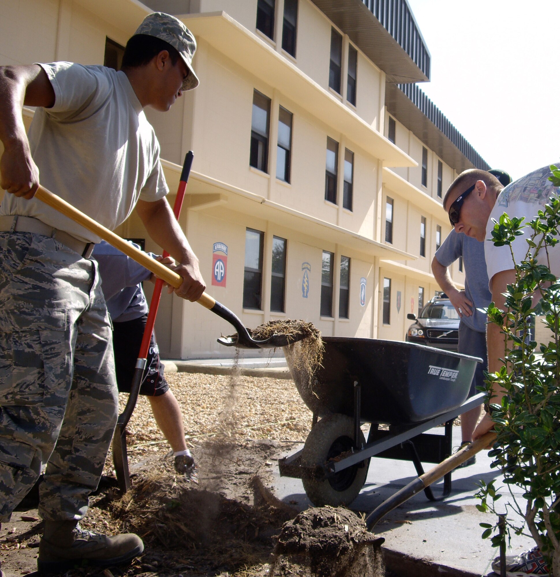 Airmen assigned to the Tactical Air Control Party Schoolhouse do landscaping around the TACP Memorial Wall at Hurlburt Field, Fla., May 16, 2010, in preparation for an upcoming ceremony honoring Senior Airman Bradley Smith. Airman Smith was killed in action in Afghanistan Jan. 3, 2010, and was the third TACP member killed since Operation Enduring Freedom began. (Courtesy photo by Tonya Keebaugh)