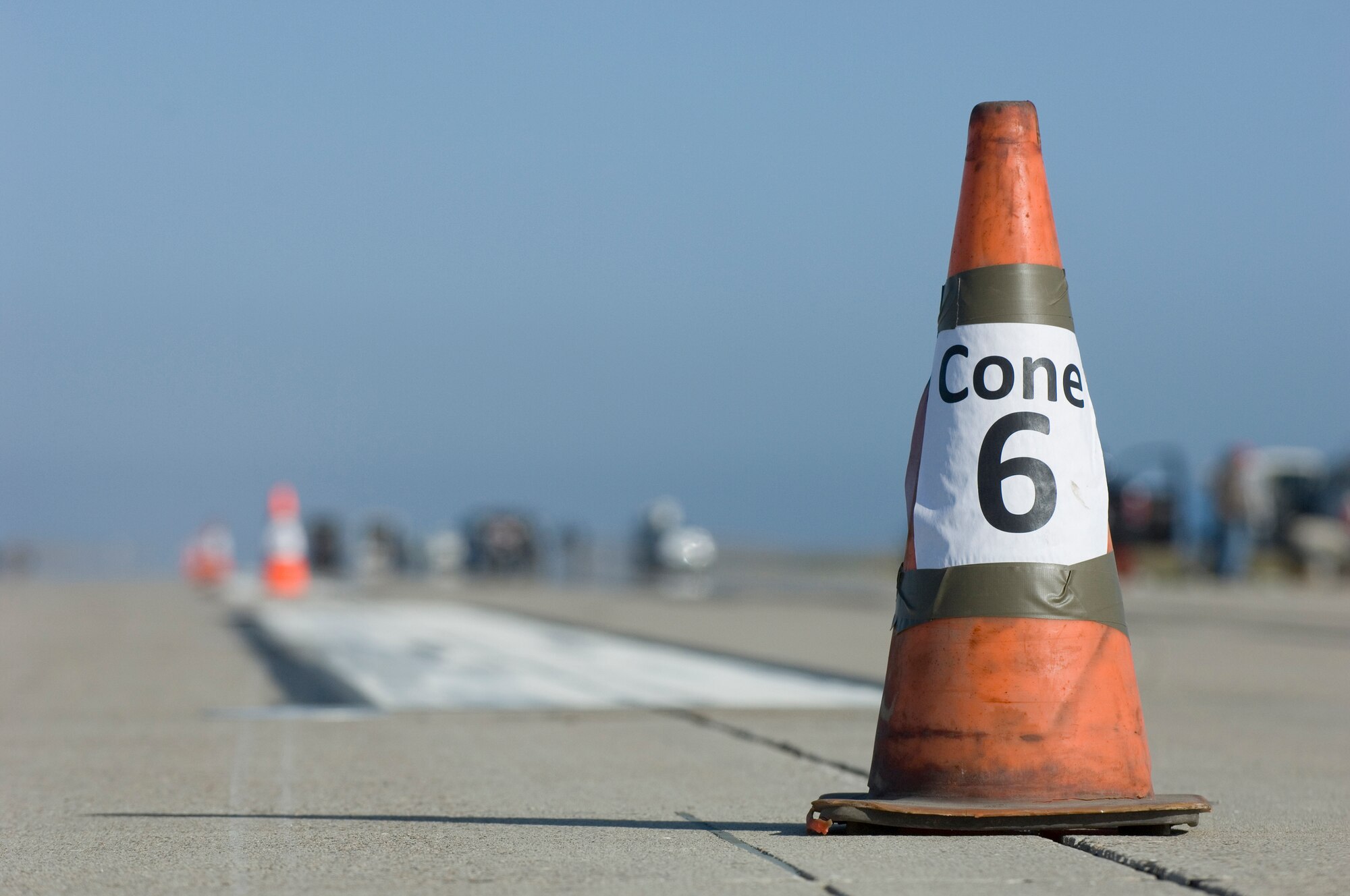 VANDENBERG AIR FORCE BASE, Calif. -- Construction crews set up numbered cones to help them coordinate where special equipment is needed to aid in the replacement of metal plates on the flightline here Saturday, May 8, 2010. Construction crews replaced the metal plates to ensure the X-37B has a safe landing. (U.S. Air Force photo by Staff Sgt. Levi Riendeau)