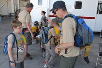 940th Wing Reservist, Major JohnTate, shows his son the finer points of the elusive yo-yo. (U.S. Air Force Photo/A1C Adam Hamar)