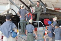 A pilot answers scouts' questions about the cockpit of the T-38.(U.S. Air Force Photo/A1C Adam Hamar)