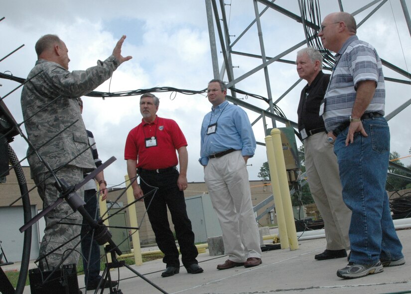 Master Sgt. William Liermann (left) discusses the challenges of operating tactical communication equipment May 13 with community leaders from the Colorado Springs, Colo., area at the Gulfport Combat Readiness Training Center in Gulfport, Miss. A total of 26 community leaders were escorted to "The Magnolia State" by the Air Force Reserve's 302nd Airlift Wing to learn more about special missions in the Air Force, to include aerial firefighting and weather reconnaissance, or "hurricane hunting." Both the latter missions are performed by the AF Reserve Command. Sergeant Liermann is a RF transmission specialist with the Mississippi Air National Guard's 255th Air Control Squadron. (U.S. Air Force photo/Staff Sgt. Stephen J. Collier)