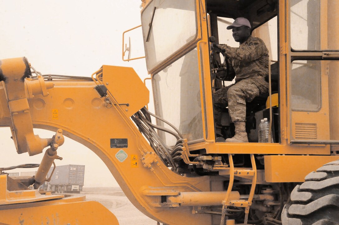 Tech. Sgt. Thomas Davidson, 557th Expeditionary RED HORSE Squadron, Ali Base, Iraq, operates a road grader May 14, 2010. Sergeant Davidson, deployed from Camp Perry ANG, Ohio, was part of the first RED HORSE squadron in Iraq and is a member of the last RED HORSE squadron to leave Iraq. (U.S. Air Force photo by Master Sgt. Darrell Habisch/released)
