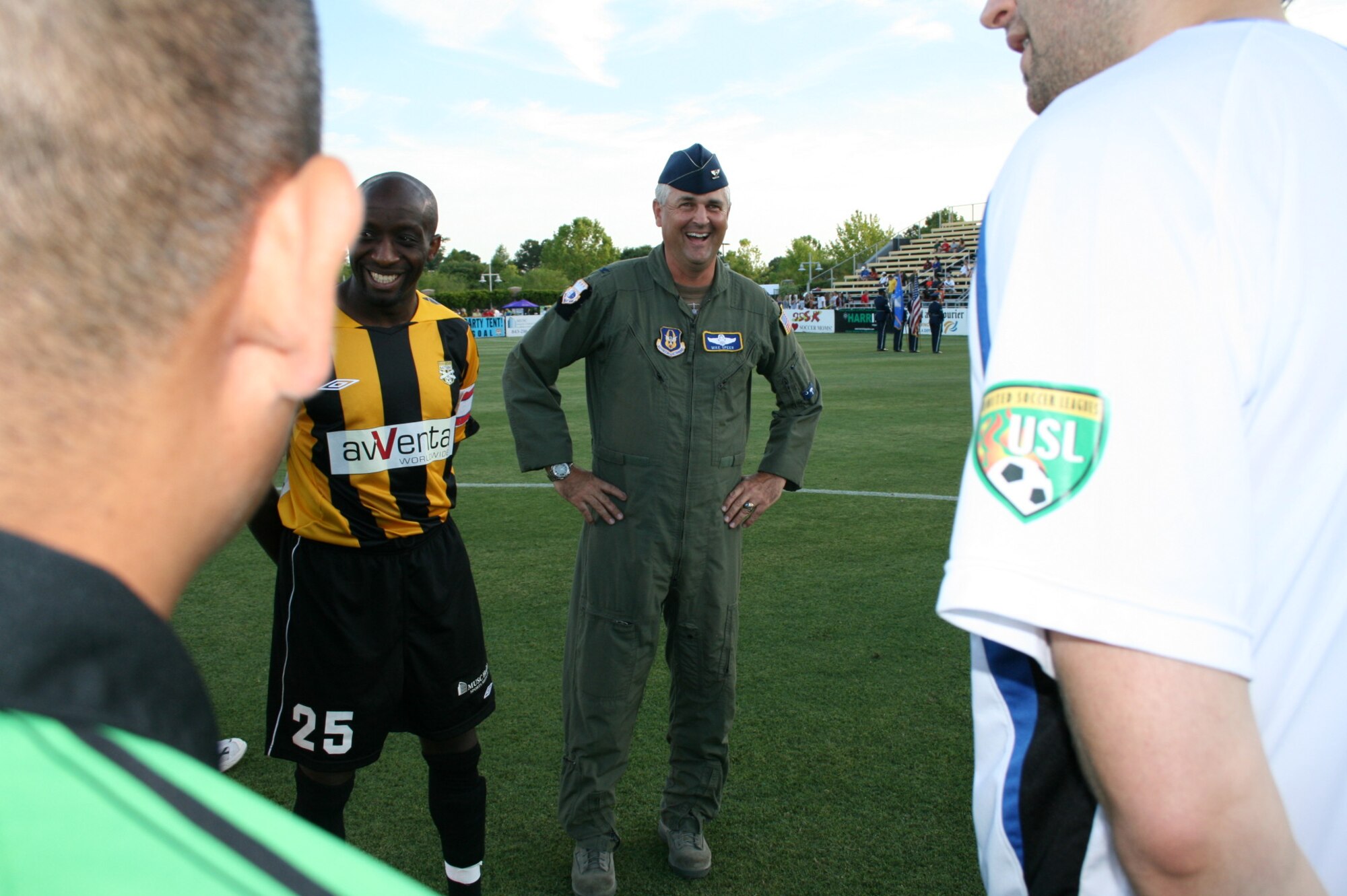 Colonel Mike Speer meets members of the Charleston Battery and Pittsburgh Riverhounds prior to the coin toss at Blackbaud Stadium May 15. Col. Speer and other members of the 315th Airlift Wing, Charleston Air Force Base S.C. were in attendance for miliary appreciation night. (U.S. Air Force Photo/TSgt Jeff Kelly)