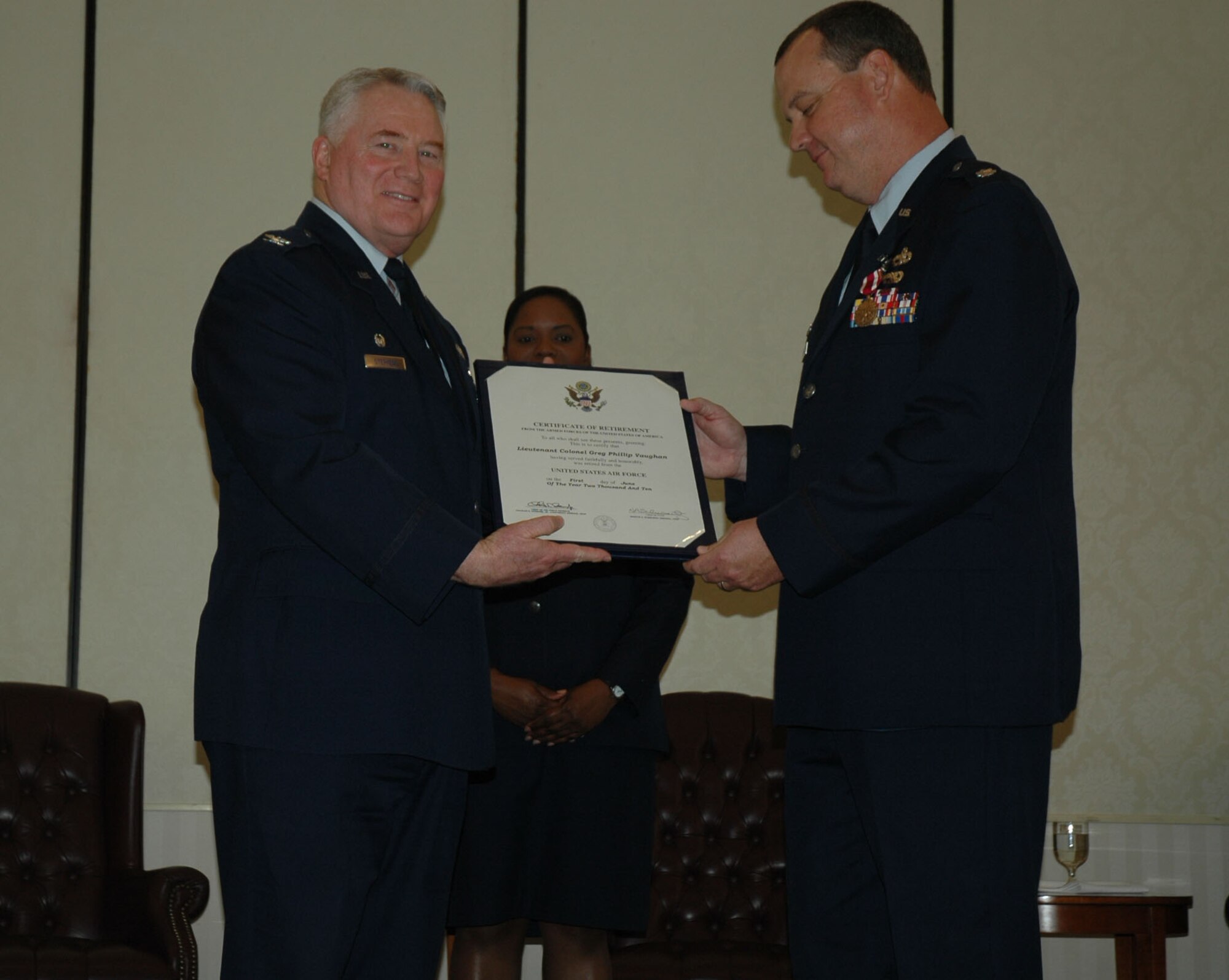 Lieutenant Colonel Greg Vaughan accpets his Crtificate of Retirement from 315th Airlift Wing Mission Support Group Commander Colonel Bill Stephens May 16 at Charleston Air Force Base S.C. Lt. Col. Vaughan had been a member of the Air Force Reserve for 27 years and the 81st APS commander for nearly two years. (U.S. Air Force Photo/2nd Lt Joe Simms)