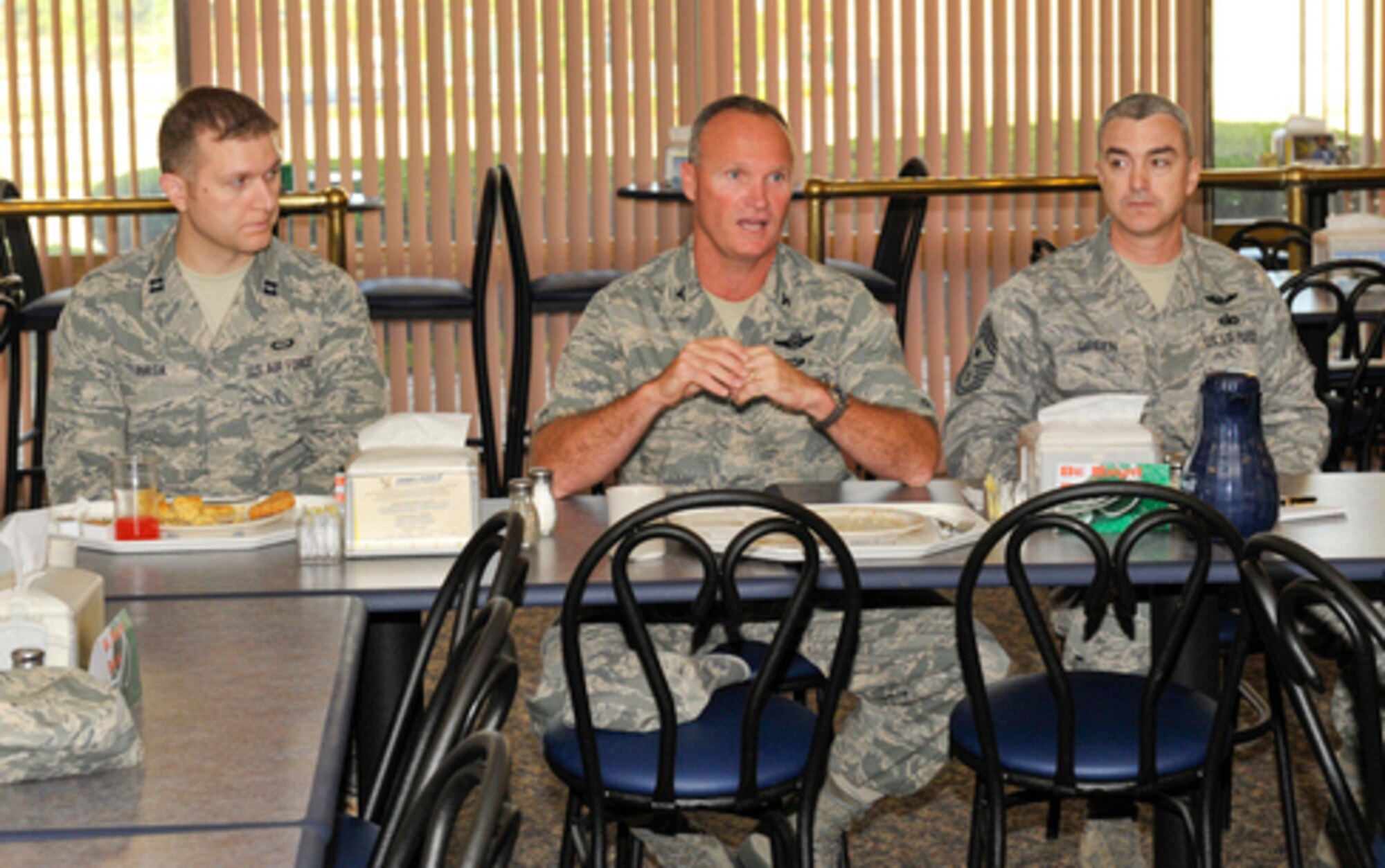(from left to right) Captain Petrit Hasa, 325th Operations Support Squadron, Colonel James Browne, 325th Fighter Wing commander, and Chief Master Sgt. Jackie Greene, 325th FW command chief attended the Company Grade Officer monthly breakfast April 27 at the Berg Liles Dining Facility. (U.S. Air Force by Jonathan Gibson)