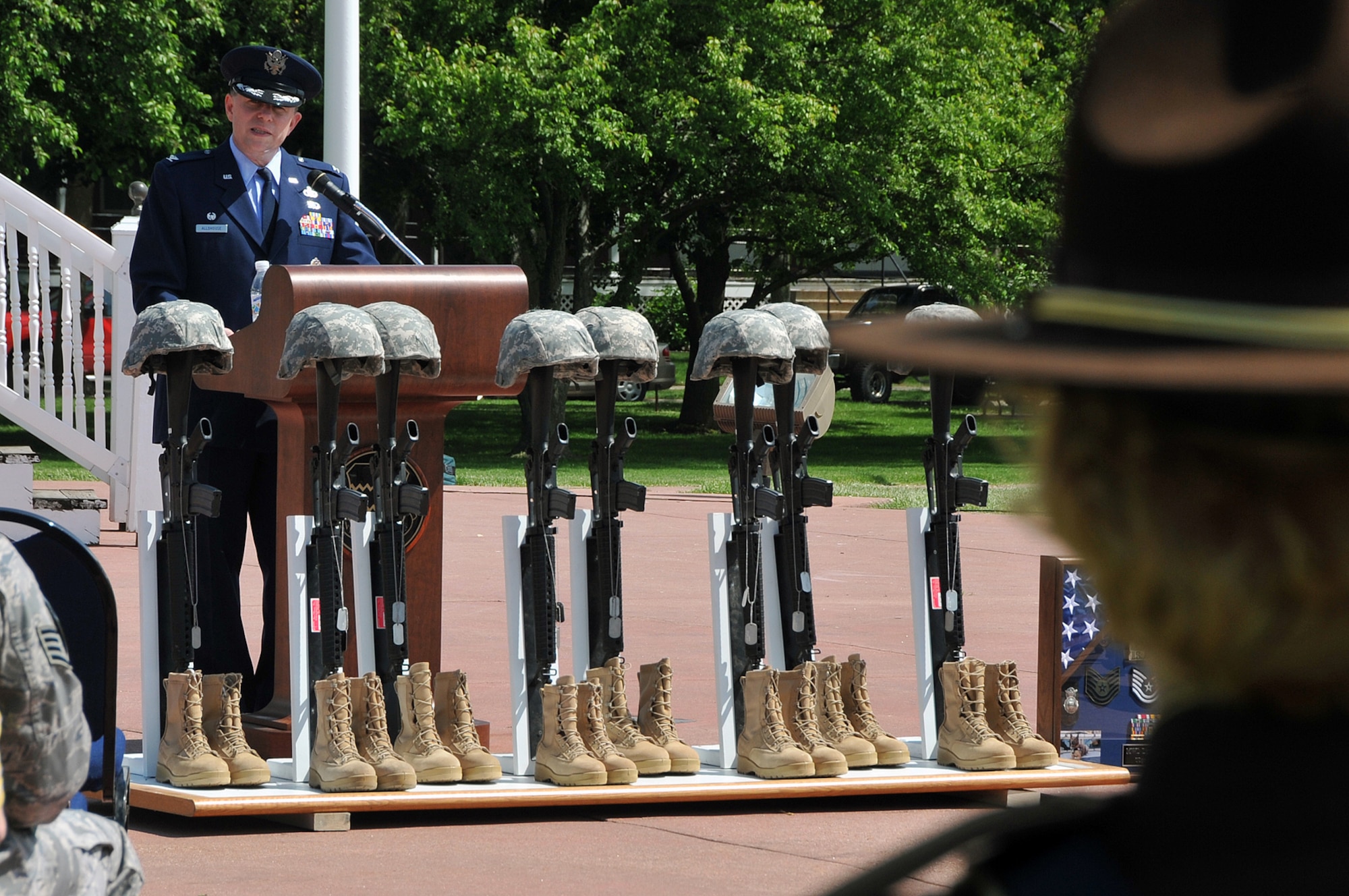 OFFUTT AIR FORCE BASE, Neb. -- Col. Michael Allshouse, 55th Mission Support Group commander, speaks about the importance of honoring all law enforcement officers at the parade grounds here during Offutt's Police Week Retreat Ceremony May 14. The event, attended by numerous law enforcement officers from across the Omaha metro area, also honored Zorro, a military working dog who recently passed away. U.S. Air Force Photo by Jeff W. Gates.