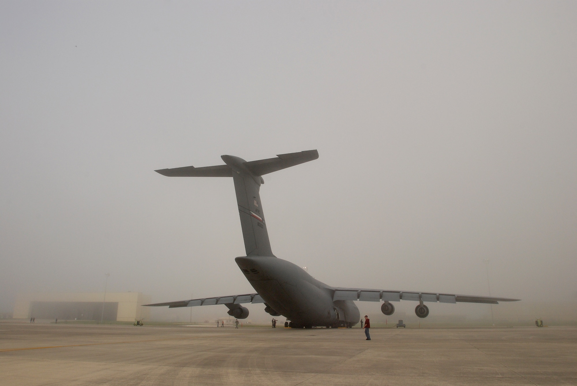 Members of the 433rd Airlift Wing, Lackland Air Force Base, Texas, walk the flightline in a Monday morning ritual searching for foreign object debris. Everyone from Col. Kenneth Lewis, wing commander,  to the brand new airman basics participate. The FOD is collected in a bag and properly disposed of. The wing vice commander Col. Dale Andrews, hides a gold-painted bolt somewhere to be found as incentive to be thorough during the FOD walk. Whomever finds the golden bolt wins their 15 minutes of fame and thanks from the roaring jet engines. (U.S. Air Force photo Airman 1st Class Brian McGloin)