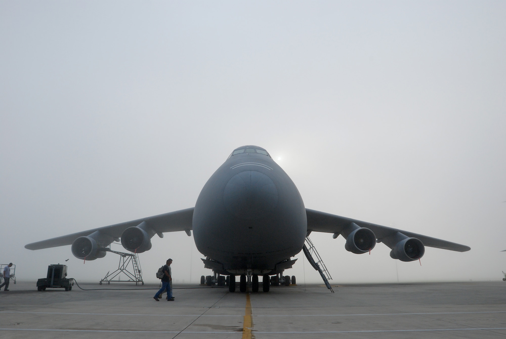 Members of the 433rd Airlift Wing, Lackland Air Force Base, Texas, walk the flightline in a Monday morning ritual searching for foreign object debris. Everyone from Col. Kenneth Lewis, wing commander,  to the brand new airman basics participate. The FOD is collected in a bag and properly disposed of. The wing vice commander Col. Dale Andrews, hides a gold-painted bolt somewhere to be found as incentive to be thorough during the FOD walk. Whomever finds the golden bolt wins their 15 minutes of fame and thanks from the roaring jet engines. (U.S. Air Force photo Airman 1st Class Brian McGloin)