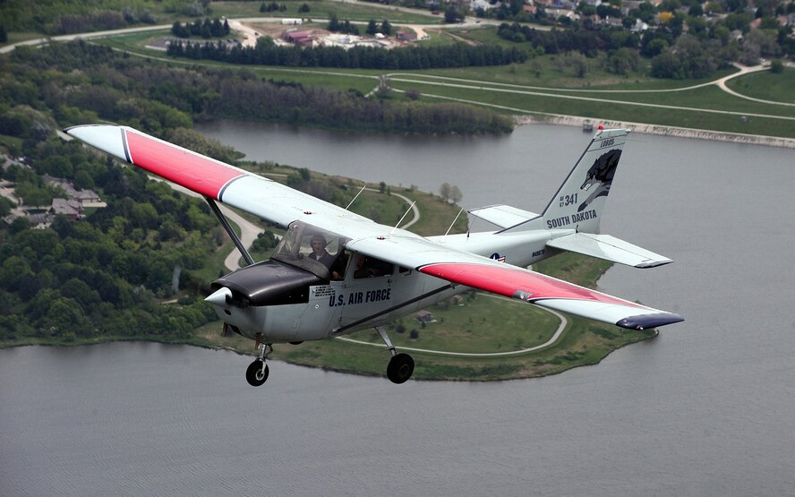 OFFUTT AIR FORCE BASE, Neb. -- Flight Instructor Barb Kalden flies over Zorinsky Lake during Aviation Opportunities Day here hosted by the LeMay Aero Club May 15. The event, provided teenagers with hands on training on how to prep an aircraft for preflight and instrument instructions. Attendees were also given aircraft tours and a one hour introductory flight with an instructor. U.S. Air Force Photo by Josh Plueger 