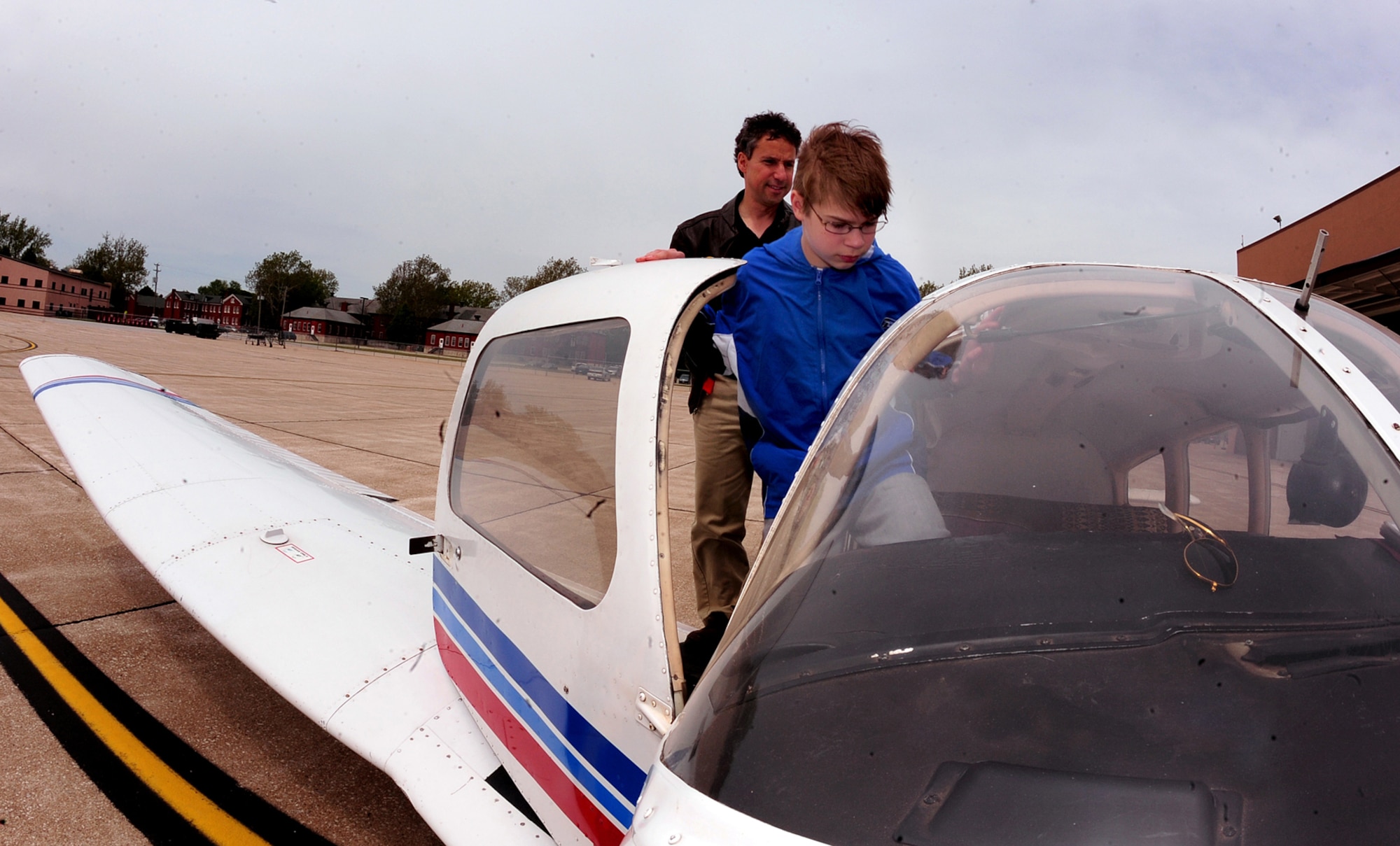 OFFUTT AIR FORCE BASE, Neb. -- Caleb Canada, son of Lt. Col. Christopher L. Canada, 55th Wing director of staff, takes his copilot seat as he embarks on a one hour flight with Earnest Desimone, a flight instructor, during Aviation Opportunities Day hosted by the LeMay Aero Club here May 15. Those who attended the event were given hands on training on how to prep an aircraft for preflight and instrument instructions. Attendees also were given aircraft tours. U.S. Air Force Photo by Josh Plueger 
