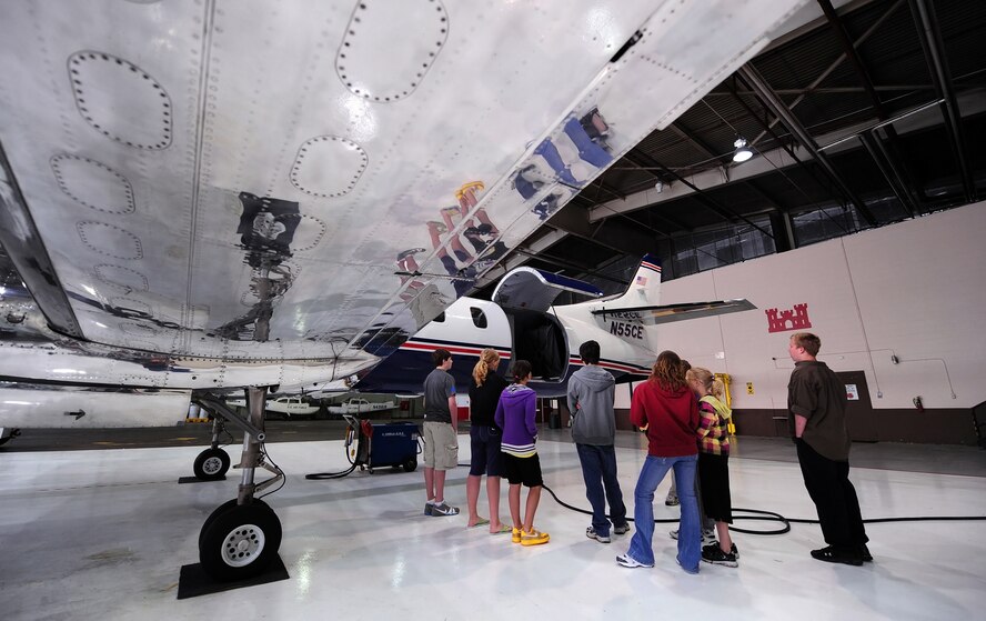 OFFUTT AIR FORCE BASE, Neb. -- Eight teenagers tour a Fairchild Metroliner, one of two in the Army Corps of Engineers inventory, during Aviation Opportunities Day hosted by the LeMay Aero Club here May 15. Those who attended the event were given hands on training on how to prep an aircraft for preflight and instrument instructions. Attendees also toured aircraft and took a one hour introductory flight with an instructor. U.S. Air Force Photo by Josh Plueger 