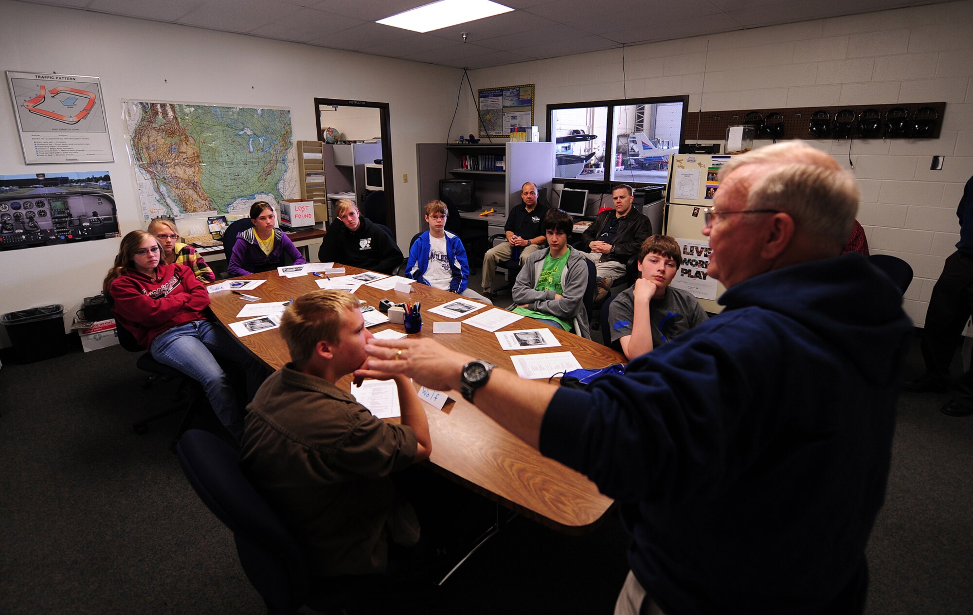 OFFUTT AIR FORCE BASE, Neb. -- Retired Lt. Col. Gary Spivey, a flight instructor at the LeMay Aero Club here, speaks to eight children about what it means to be a pilot, not only in the Air Force, but in the private sector as well, during Aviation Opportunities Day hosted by the LeMay Aero Club here May 15. Those who attended the event were given hands on training on how to prep an aircraft for preflight and instrument instructions. Attendees also toured aircraft and took a one hour introductory flight with an instructor. U.S. Air Force Photo by Josh Plueger 
