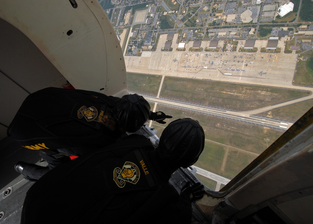JOINT BASE ANDREWS, Md.-- U.S. Army Parachute team "Golden Knights" member SPC. Brandie Phillips (left) points out the landing target to SGT Brandon Valle (right) before jumping for the crowd at the Joint Service Open House.  This is the first Joint Service Open House conducted by Team Andrews members at the newly minted Joint Base Andrews, continuing a rich tradition of partnership and strength rooted in service to the nation.  (U.S. Navy photo by Mass Communication Specialist 2nd Class Clifford L. H. Davis)