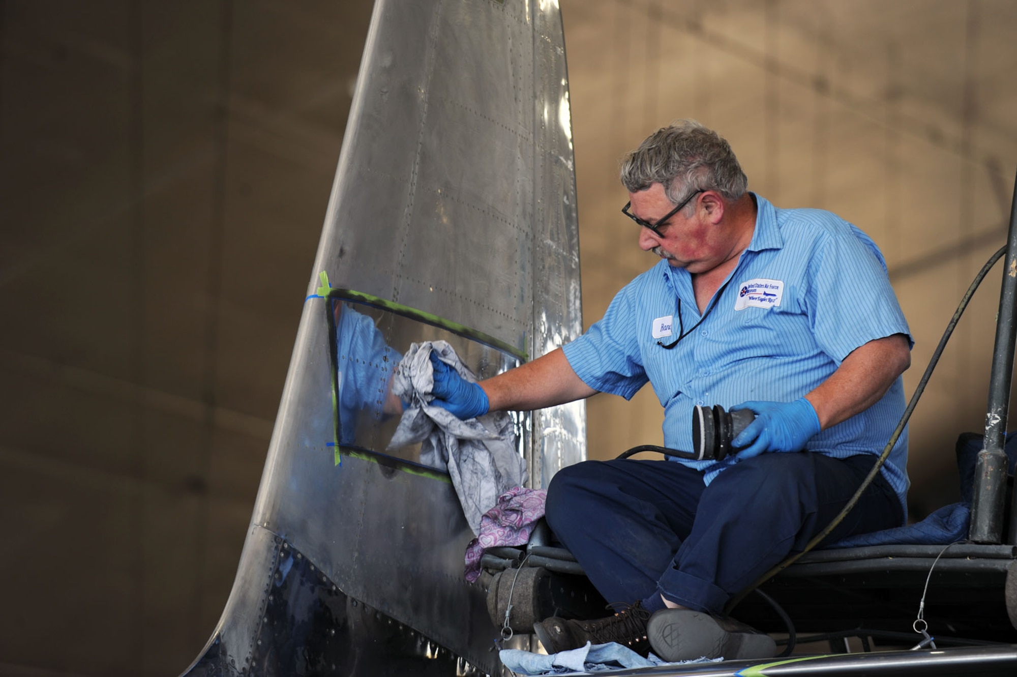 DAYTON, Ohio (04/2010) -- A restoration specialist works on the F-84 in the Restoration Hangar at the National Museum of the U.S. Air Force. (U.S. Air Force photo/Master Sgt. William Greer)