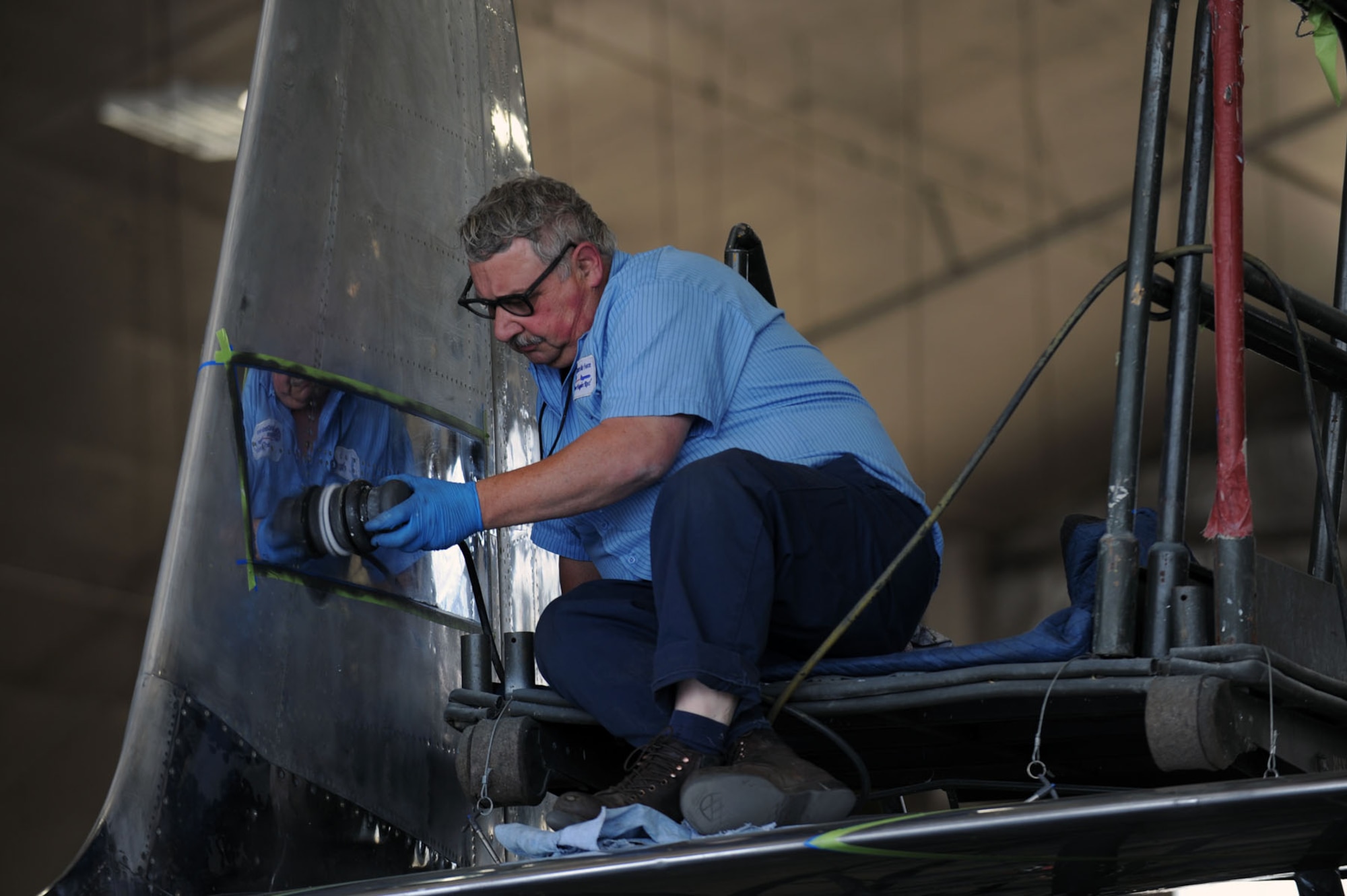 DAYTON, Ohio (04/2010) -- A restoration specialist works on the F-84 in the Restoration Hangar at the National Museum of the U.S. Air Force. (U.S. Air Force photo/Master Sgt. William Greer)