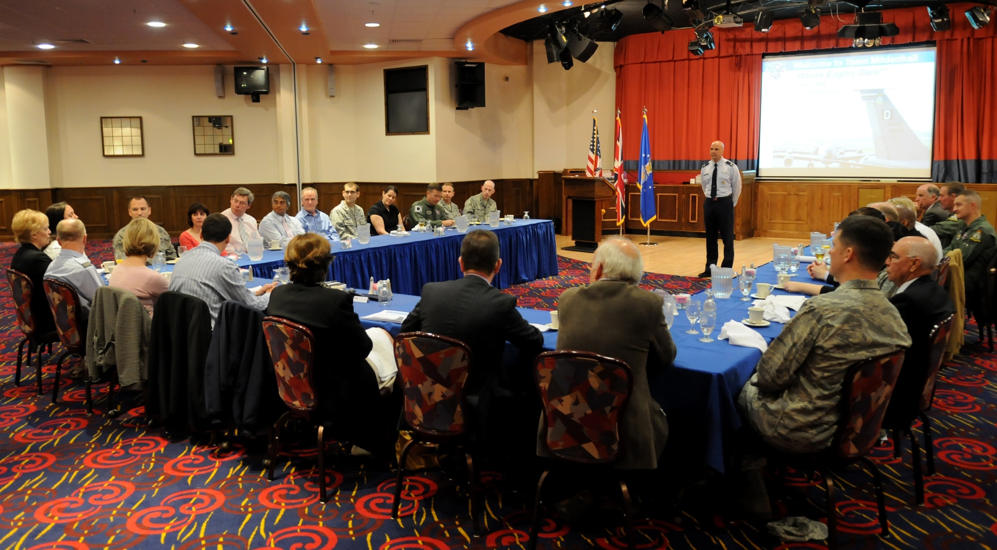 RAF MILDENHALL, England – Col. Chad Manske, 100th Air Refueling Wing commander, briefs visiting members of the Newmarket Chamber of Commerce during a breakfast meeting at the Galaxy Club May 14.  Col. Manske explained the history, facts and mission impact of Team Mildenhall while also addressing the roles and responsibilities that Airmen play in the local community. The purpose of the visit was to strengthen partnerships, relations, business and social links between the local community and the U.S. Military. (U.S. Air Force photo/ Staff Sgt. Jerry Fleshman)