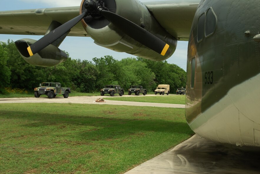 Members of the 433rd Civil Engineering Squadron engage in convoy training under real and simulated battlefield conditions. The training had instruction and demonstration as well as simulated explosions, attacks with wounded to be MEDEVACed as well as navigating a course with checkpoints. (U.S. Air Force photo/Airman 1st Class Brian McGloin)