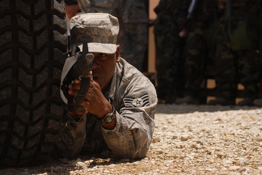 Members of the 433rd Civil Engineering Squadron engage in convoy training under real and simulated battlefield conditions. The training had instruction and demonstration as well as simulated explosions, attacks with wounded to be MEDEVACed as well as navigating a course with checkpoints. (U.S. Air Force photo/Airman 1st Class Brian McGloin)