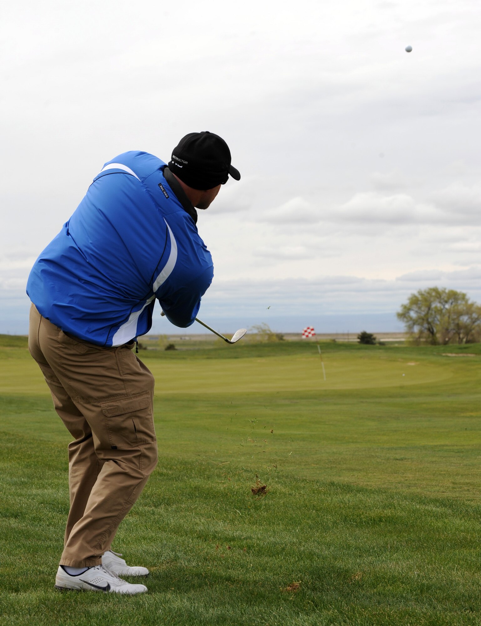 MOUNTAIN HOME AIR FORCE BASE, Idaho -- Kirt Rothe, Federal Law Enforcement Training Center, chips during a golf tournament celebrating National Police Week May 10. National Police week is a time to pay tribute to law enforcement officers who lost their lives in the line of duty for the safety and protection of others, according to the National Peace Officer's Memorial Fund website. (U.S. Air Force photo by Airman 1stClass Debbie Lockhart)
