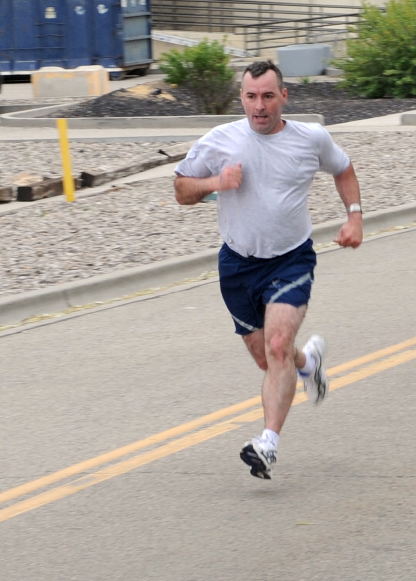 MOUNTAIN HOME AIR FORCE BASE, Idaho – Chief Master Sgt. Ronald McCarthy, 366th Fighter Wing command chief, finishes a 5K run to celebrate National Police Week outside the Security Forces Squadron May 10. An average of 165 officers are killed in the line of duty each year which is approximately one every 53 hours. National Police week is a time to pay tribute to law enforcement officers who lost their lives in the line of duty for the safety and protection of others, according to the National Peace Officer's Memorial Fund website. (U.S. Air Force photo by Airman 1stClass Debbie Lockhart)