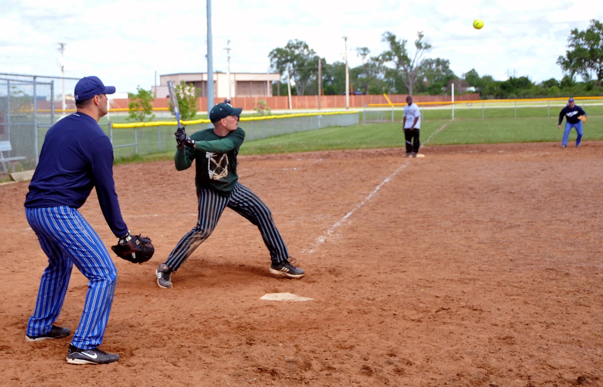 OFFUTT AIR FORCE BASE, Neb. -- Tech. Sgt. Nicholas Melenka, 55th Security Forces Squadron, prepares to hit the ball during Offutt's Police Week Softball Tournament here May 13.  The tournament was one of Offutt's many events in observance of National Police Week which also included a static weapons display, military working dog demonstration and a retreat ceremony. U.S. Air Force Photo by Jeff W. Gates.