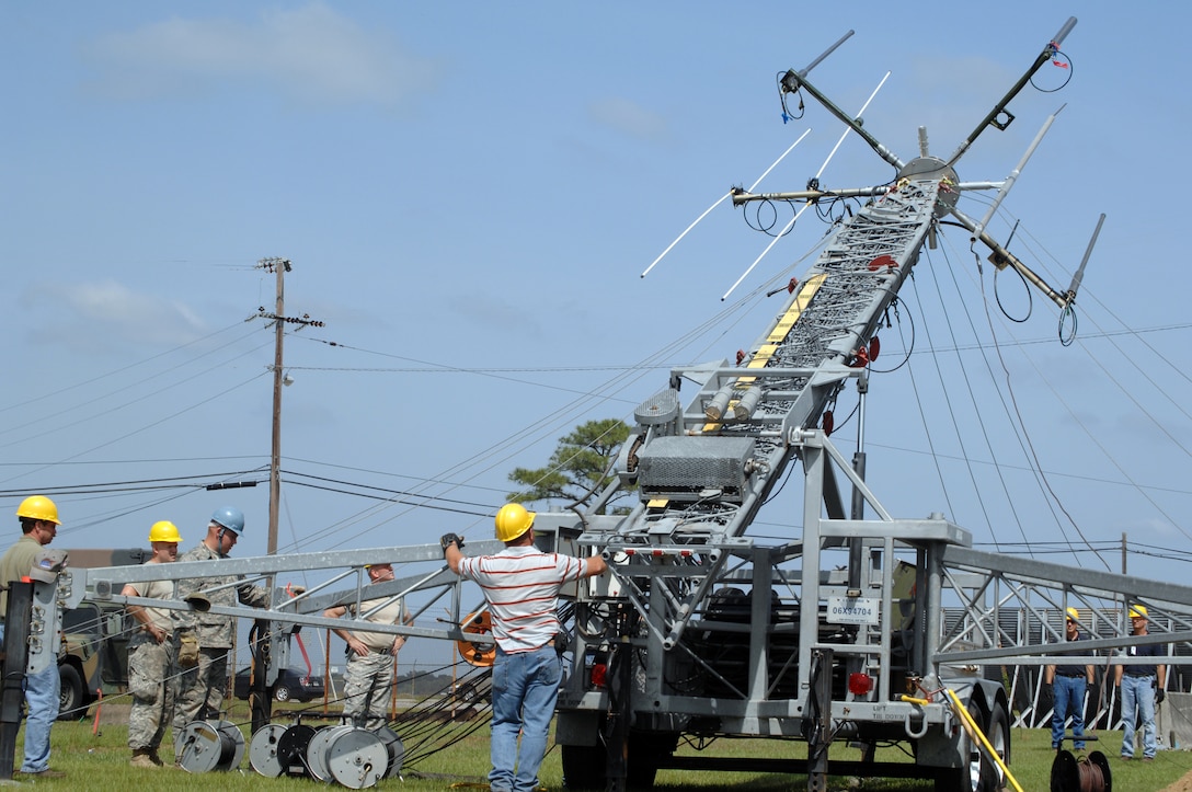 Savannah GA. -- U.S. Army Soldiers and civilians standby as the antenna tower is being deployed during Ardent Sentry 2010 on the Savannah Combat Readiness Center in Savannah, GA. (U.S. Air Force photo by AMN Allen Stokes)