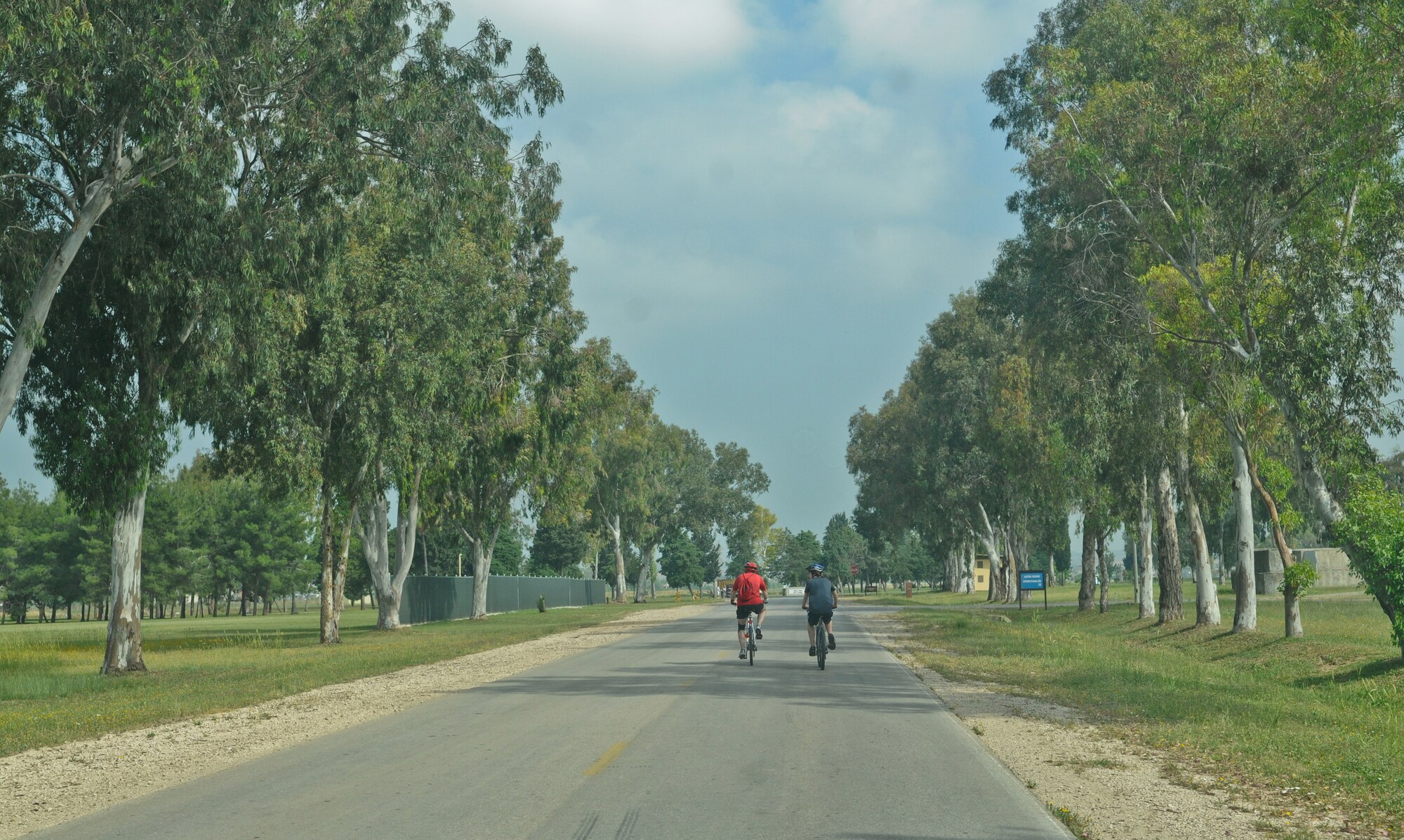 Chief Master Sgt. Richard Price, 39th Maintenance Squadron, and son Eric bike toward their next goal during the “Amazing Race” challenge Saturday May 15, 2010 Incirlik Air Base, Turkey. With 12 challenges, teams of two worked together to complete the obstacles or had the option to pay out of the obstacle to progress. (U.S. Air Force photo/Senior Airman Alexandre Montes)