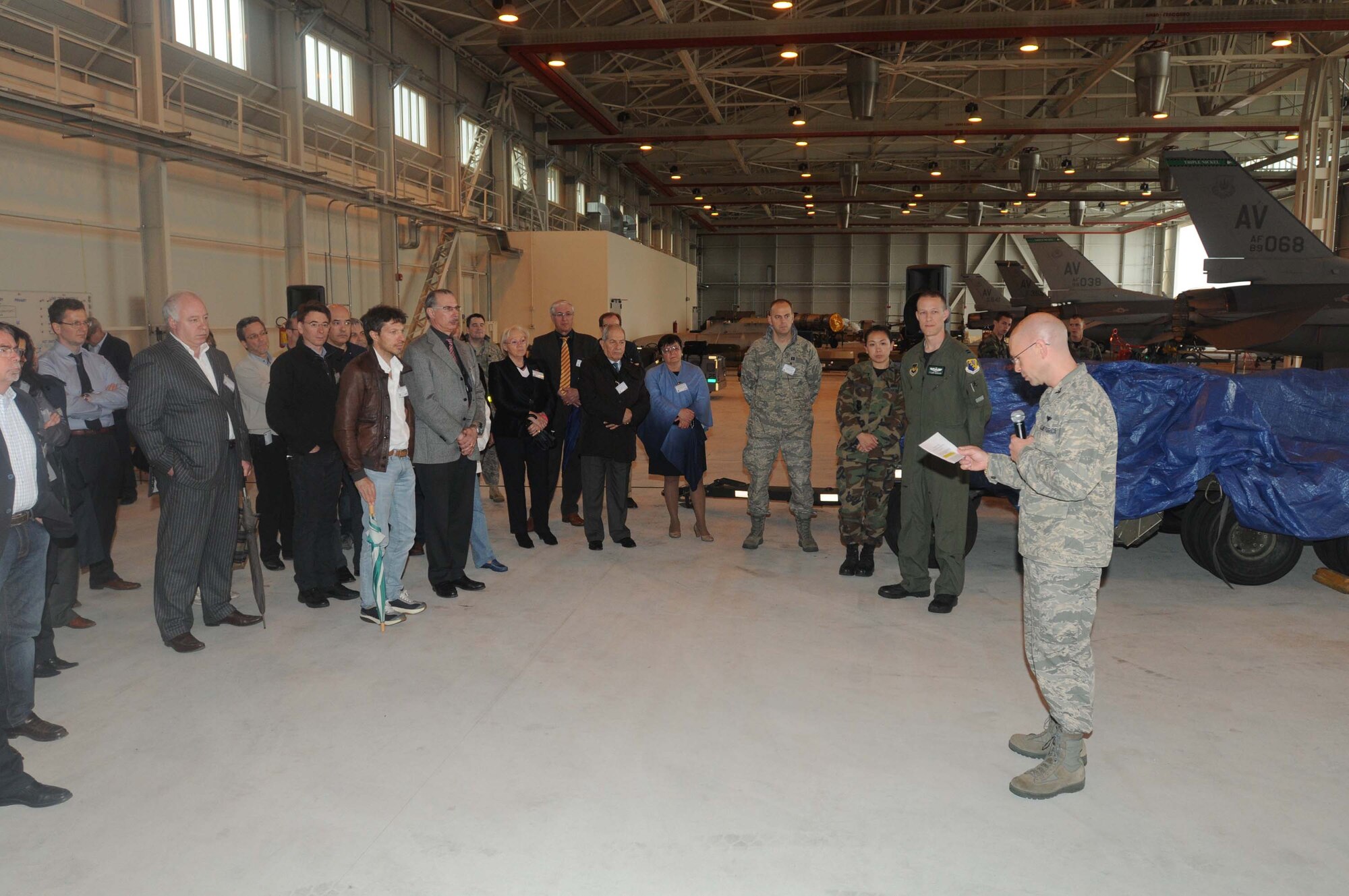 Col. Patrick McClelland, 31st Fighter Wing vice commander, greets off-base doctors associated with the Tricare program as they take their tour through Hangar 3 on May 13. The doctors were able to see a plethora of items during their tour of Hangar 3 including an F-16 Fighting Falcon. (U.S. Air Force photo/Airman LaVel Sterling)