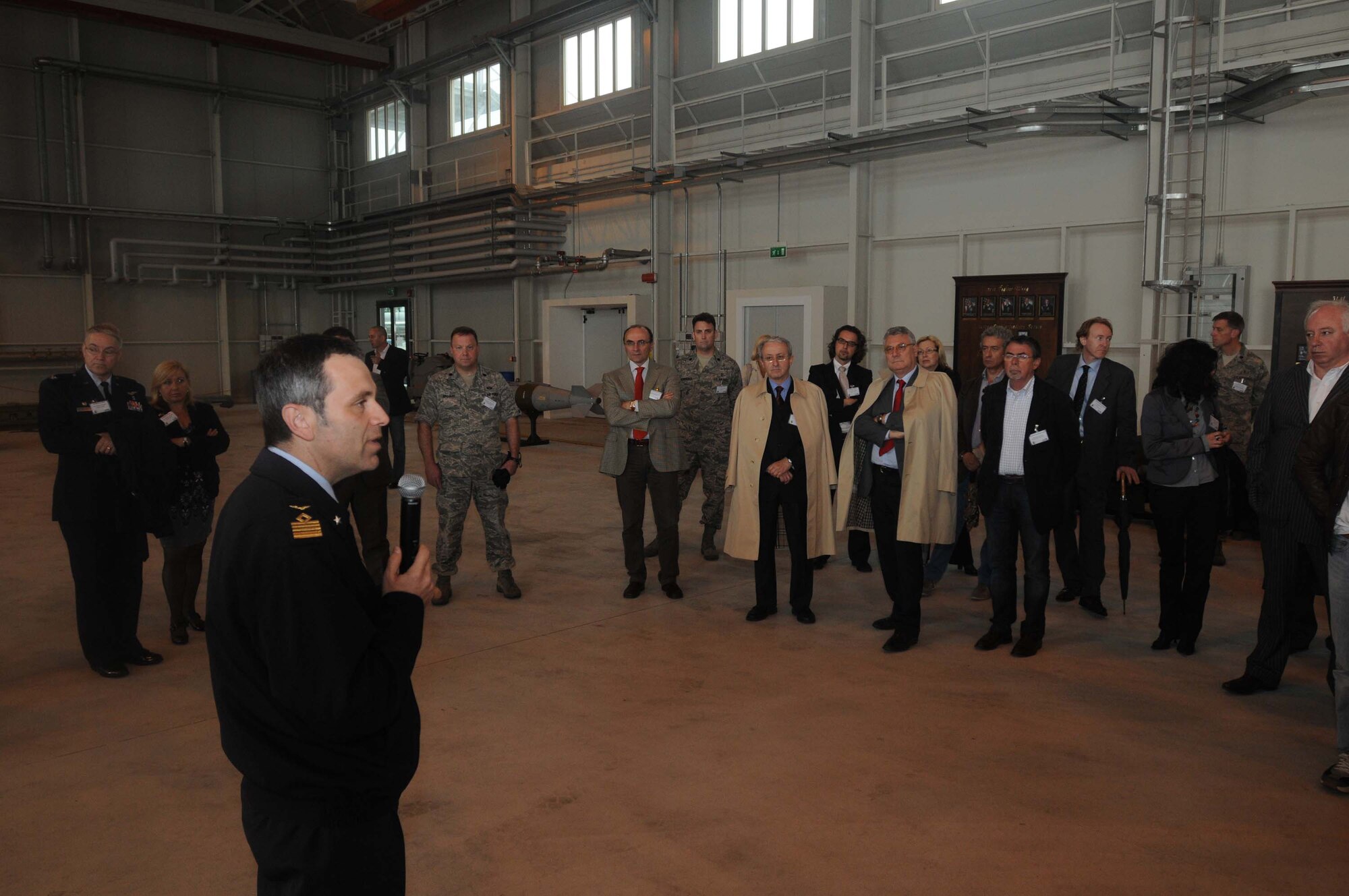 Italian air force Col. Fillippo Zampella, Pagliano e Gori Airport commander, expresses his appreciation to off-base doctors who are involved in the Tricare program May 13. More than 50 off-base Tricare doctors visited Aviano for a special tour of Hangar 3.(U.S. Air Force photo/Airman LaVel Sterling)