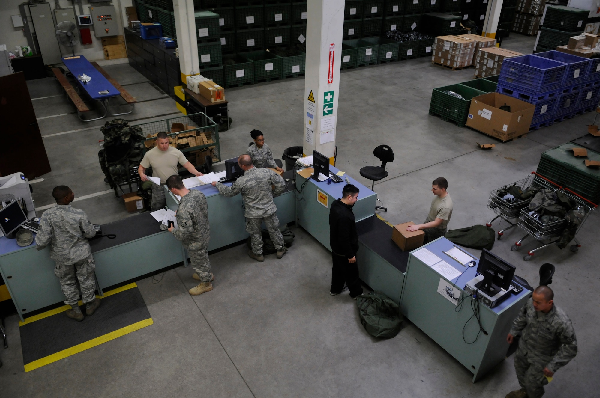 Airmen receive new chemical protective gear at the 86th Logistics Readiness Squadron's individual protective equipment facility Ramstein Air Base, Germany, May 14, 2010. Many Airmen have visited the facility to exchange their outdated gear in preparation for the upcoming Operational Readiness Inspection. (U.S. Air Force photo by Airman 1st Class Desiree Esposito)