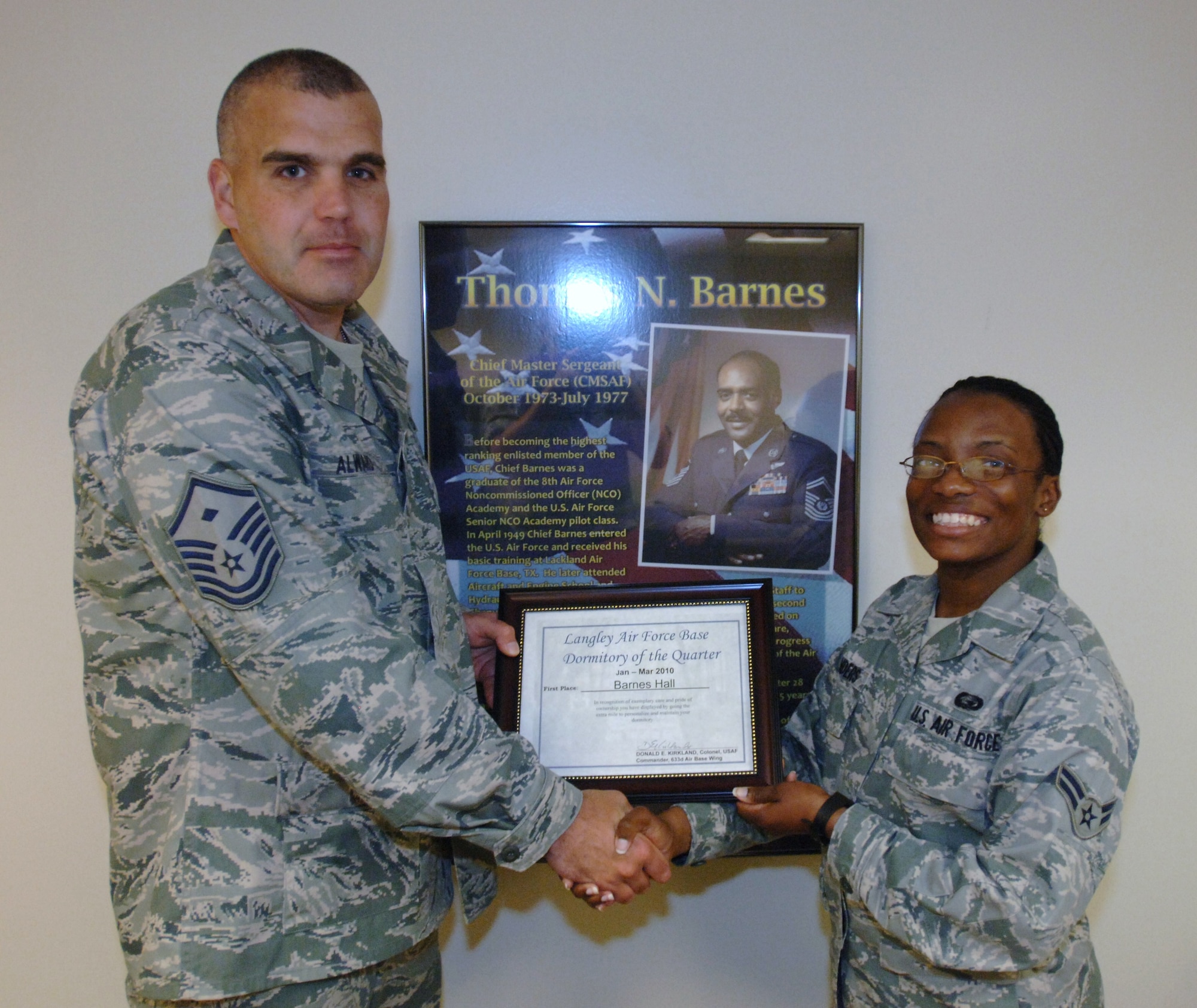 LANGLEY AIR FORCE BASE, Va. -- Airman 1st Class Mahogany Saunders, 497th Intelligence, Surveillance and Reconnaissance Group personnel apprentice, displays the Dorm of the Quarter certificate for Barnes Hall alongside Master Sgt. Travis Alward, 10th Intelligence Squadron first sergeant, at the first floor day room May 13. Saunders serves as the dorm council president for Barnes Hall. (U.S. Air Force photo/Airman 1st Class Jason J. Brown)