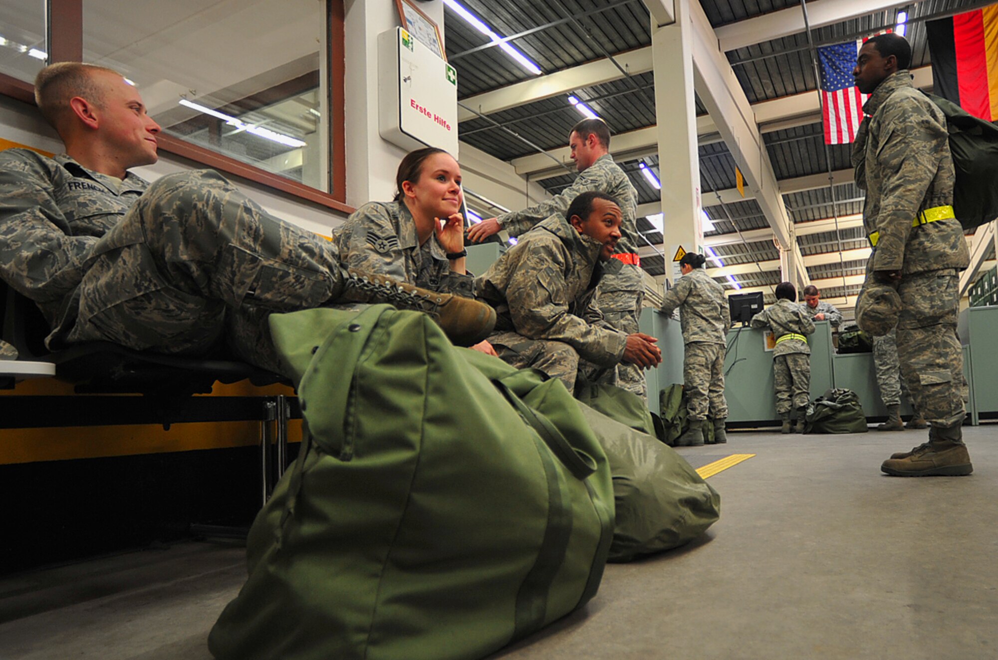 Airmen wait to receive new chemical protective gear at the 86th Logistics Readiness Squadron’s individual protective equipment facility, Ramstein Air Base, Germany, May 17, 2010. Many Airmen have visited the facility to exchange their outdated gear in preparation for the upcoming Operational Readiness Inspection. (U.S. Air Force photo by Senior Airman Tony R. Ritter)