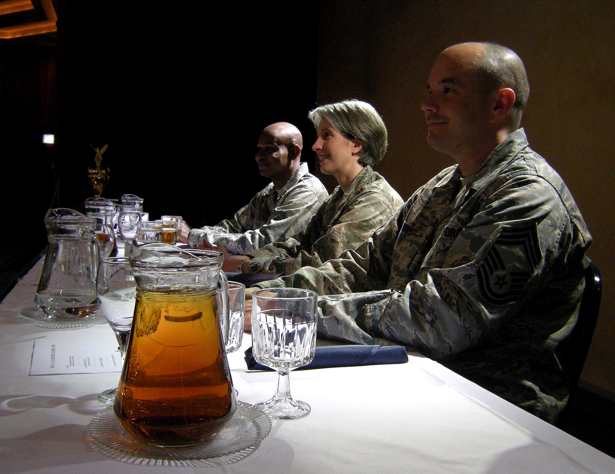SPANGDAHLEM AIR BASE, Germany – Judges await the first course to arrive during the first Ultimate Chef Showdown at Club Eifel May 13. Judges included (from left) 2nd Lt. Timothy Alexander, 726th Air Mobility Squadron executive officer, Lt. Col. Karen Stoff, 52nd Logistics Readiness Squadron commander and Chief Master Sgt. Michael Irons, 52nd Mission Support Group superintendent.  Contenders in the culinary competition were the Spangdahlem Dining Facility and Club Eifel. The overall winner was Club Eifel, while the dining facility was commended for having the best appetizer and dessert.  (U.S. Air Force photo/2nd Lt. Kathleen Polesnak)