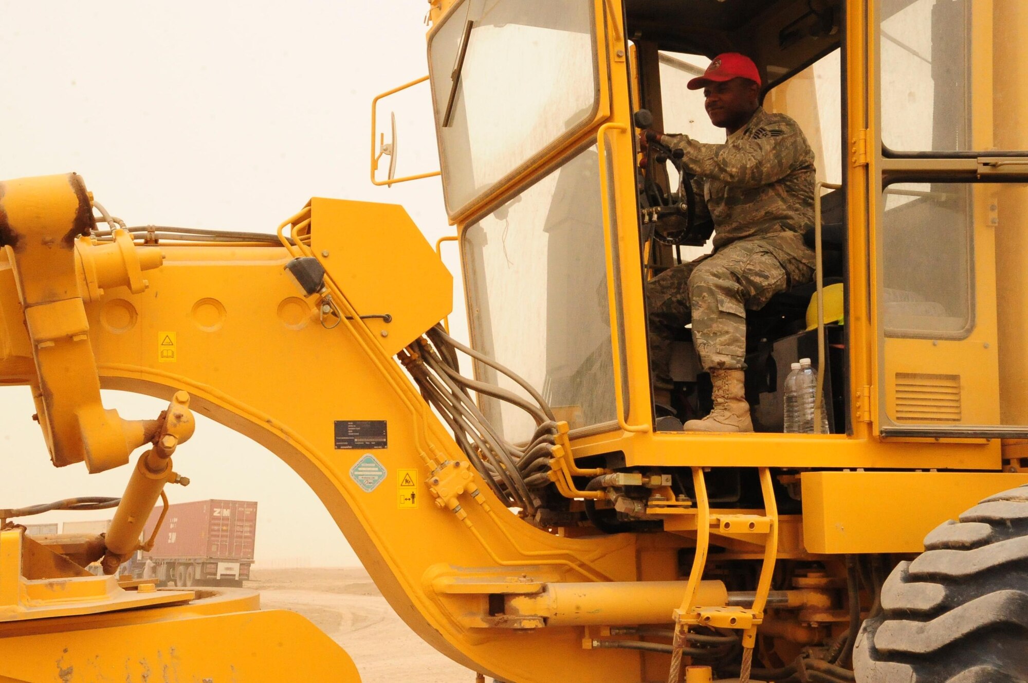 Tech. Sgt. Thomas Davidson, 557th Expeditionary RED HORSE Squadron, Ali Base, Iraq, operates a road grader May 14, 2010.  Sergeant Davidson, deployed from Camp Perry ANG, Ohio, was part of the first RED HORSE squadron in Iraq and is a member of the last RED HORSE squadron to leave Iraq. (U.S. Air Force photo by Master Sgt. Darrell Habisch/released)
