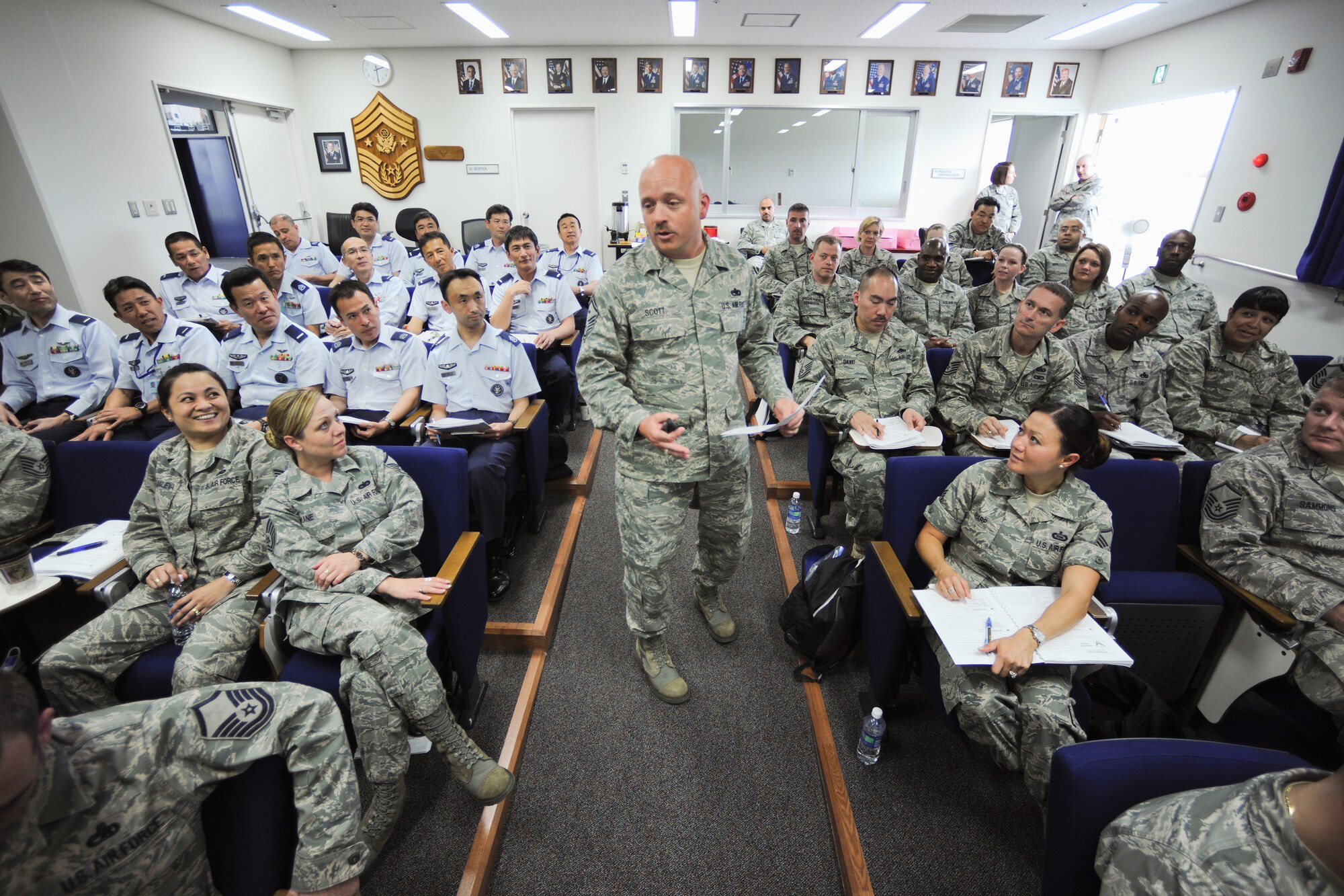 YOKOTA AIR BASE, Japan -- Senior Master Sgt. David Scott, Air Force First Sergeant Academy Active-Duty Course Director, prepares 99 enlisted leaders from around Japan to better care for their Airmen during the Additional Duty First Sergeant Seminar here May 11-14. The five day seminar covered topics including financial responsibilities, administrative actions and suicide prevention. (U.S. Air Force photo/Osakabe Yasuo)