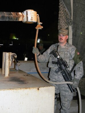 SOUTHWEST ASIA ? U.S. Air Force Staff Sgt. William Blado, a security forces NCO with the 387th Expeditionary Security Forces Squadron mans the gate at an entry control point at an undisclosed location here March 31, 2010. Sergeant Blado spends most of his on-duty time performing contingency air base defense, resources protection, and other installation security tasks. (U.S. Air Force photo by Capt. Mollie Robinson/Released)