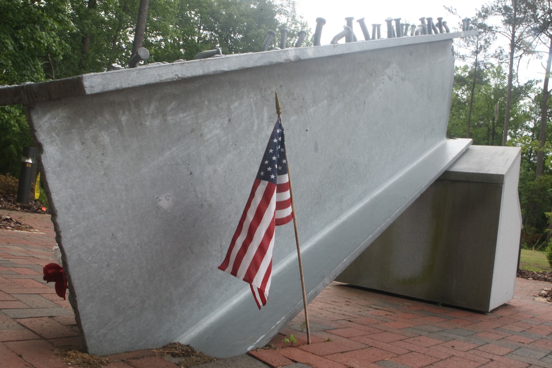 A beam from the north tower of the World Trace Center after the terrorist attack on Sept. 11, 2001 sits in the Lejeune Memorial Gardens as a reminder of the events of nearly a year ago.