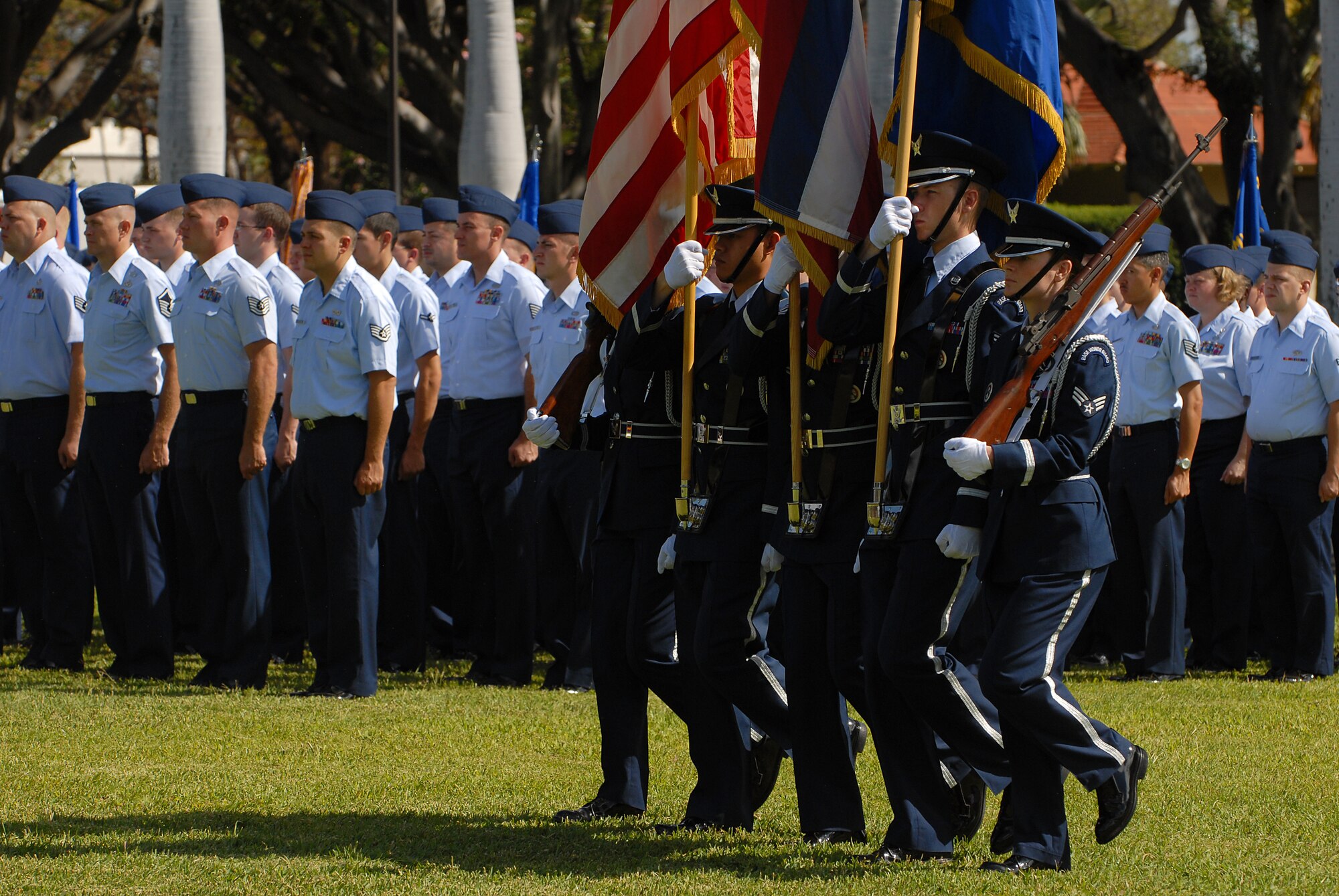 JOINT BASE PEARL HARBOR HICKAM, Hawaii - The Hickam Honor Guard post the colors during the 15th Wing change of command May 18. Col. Sam Barrett assumed command from Col. Giovanni Tuck. The change of command also included a re-designation from the 15th Airlift Wing to the 15th Wing.  The re-designation reflects the mission change of the 15th Wing that will activate an active duty F-22 squadron and KC-135 squadron this summer. (U.S. Air Force photo/Staff Sgt. Mike Meares)