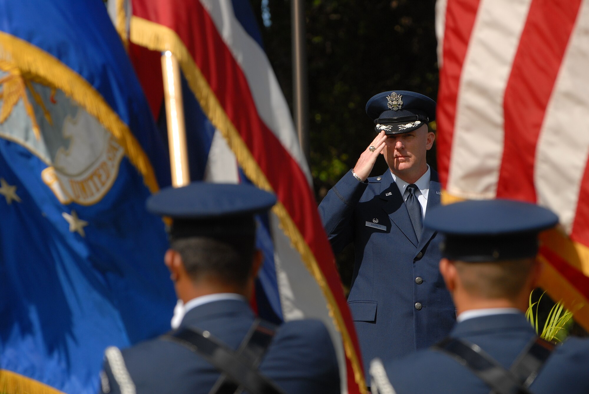 JOINT BASE PEARL HARBOR HICKAM, Hawaii - Col. Sam Barrett, 15th Wing commander, salutes the colors during his change of command ceremony May 18. The change of command also included a re-designation from the 15th Airlift Wing to the 15th Wing and remains assigned to the 13th Air Force. The re-designation reflects the mission change of the 15th Wing that will activate an active duty F-22 squadron and KC-135 squadron this summer. (U.S. Air Force photo/Staff Sgt. Mike Meares)