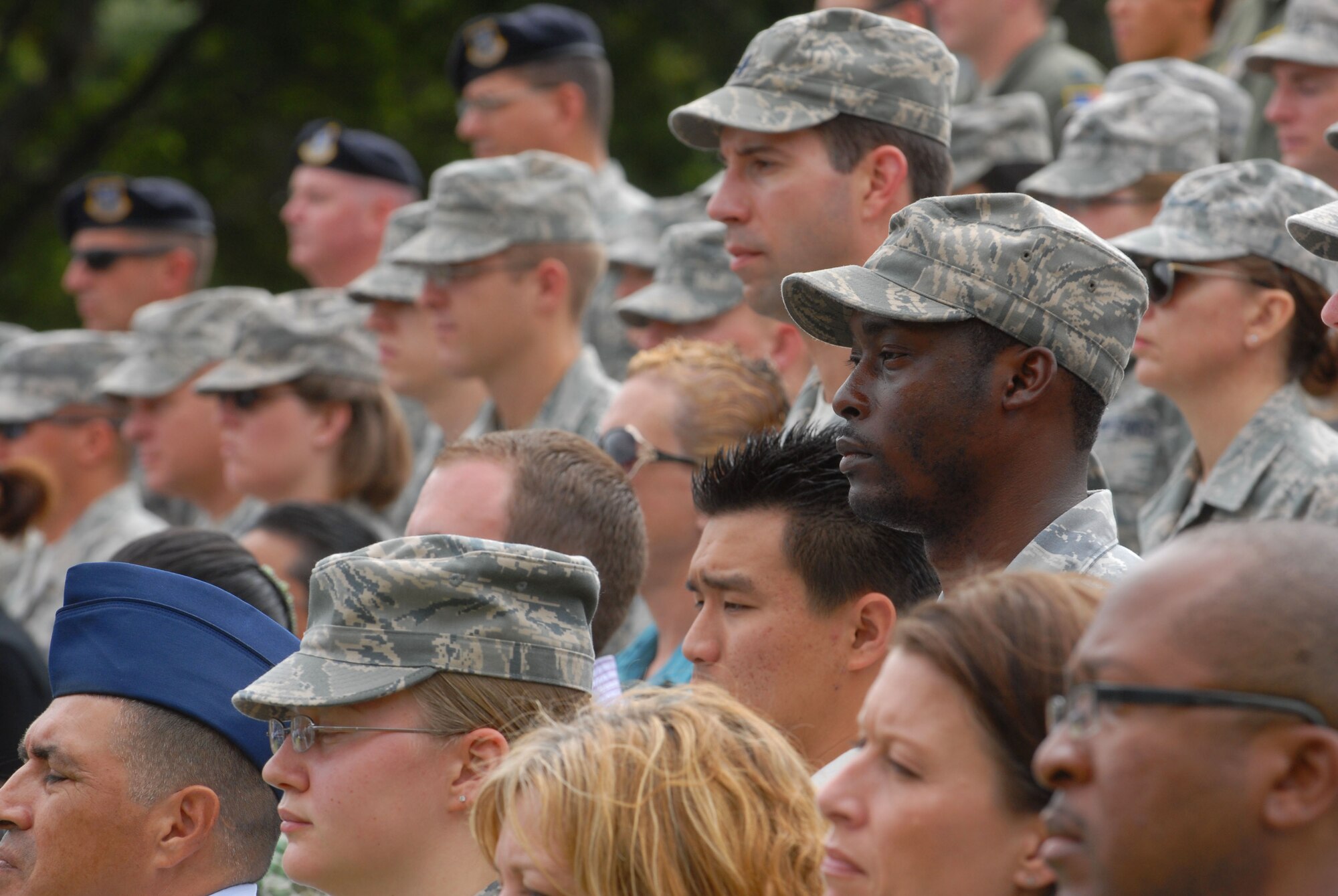 JOINT BASE PEARL HARBOR HICKAM - Hawaii - Hickam Airmen stand at attention during the 15th Wing change of command here, May 18. The change of command also included a re-designation from the 15th Airlift Wing to the 15th Wing and remains assigned to the 13th Air Force. The re-designation reflects the mission change of the 15th Wing that will activate an active duty F-22 squadron and KC-135 squadron this summer. (U.S. Air Force photo/Senior Airman Gustavo Gonzalez) 