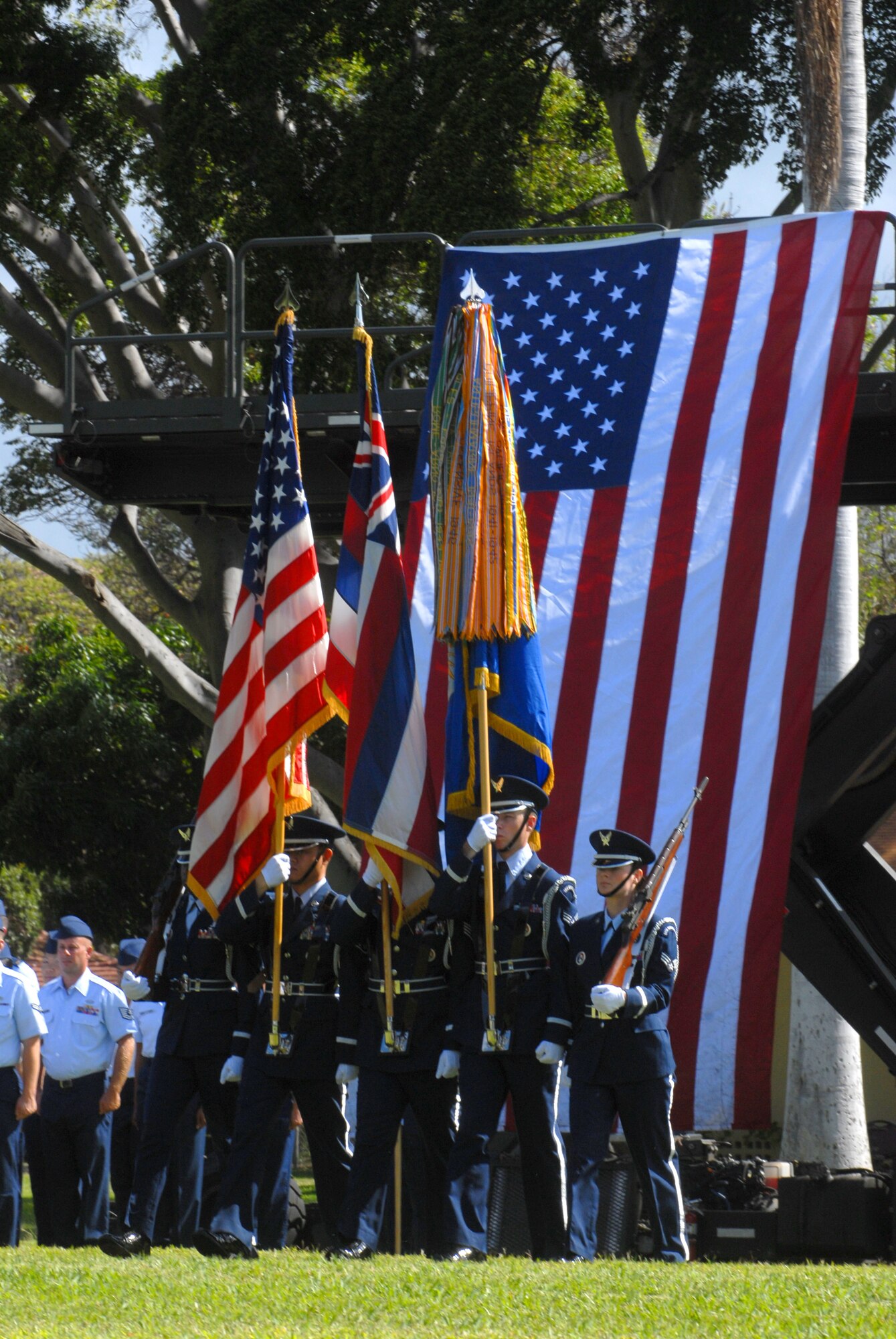 JOINT BASE PEARL HARBOR HICKAM, Hawaii - The Hickam Honor Guard post the colors during the 15th Wing change of command here, May 18. The change of command also included a re-designation from the 15th Airlift Wing to the 15th Wing and remains assigned to the 13th Air Force. The re-designation reflects the mission change of the 15th Wing that will activate an active duty F-22 squadron and KC-135 squadron this summer. (U.S. Air Force photo/Senior Airman Gustavo Gonzalez) 