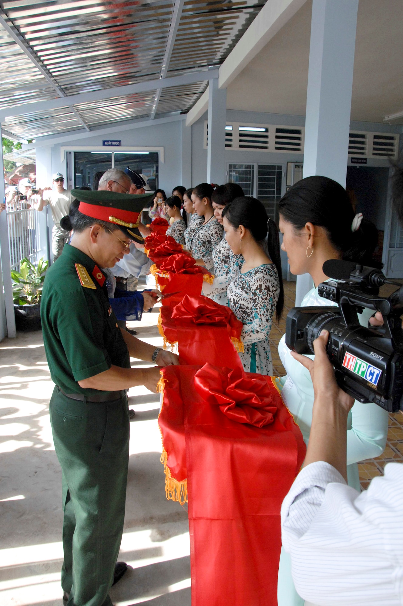 Vietnamese Col. Van Tham and others cut a ribbon marking the re-opening of the Tan Thoi Village Medical Clinic as part of Pacific Angel 2010 May 17, 2010, in Tan Thoi, Vietnam. Colonel Tham is from the Vietnam Military Region 9. (U.S. Air Force photo/Capt. Timothy Lundberg)